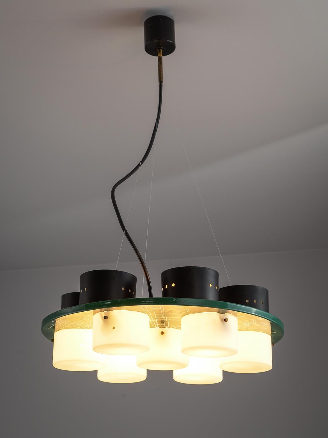 Suspension lamp, metal, glass and lacquered wood, Italy, 1970s

These Italy ceiling lights feature a circular base that holds 6 glass shades. The green and white lacquered base shows an abstract drawings, consisting of white lines. Due to its