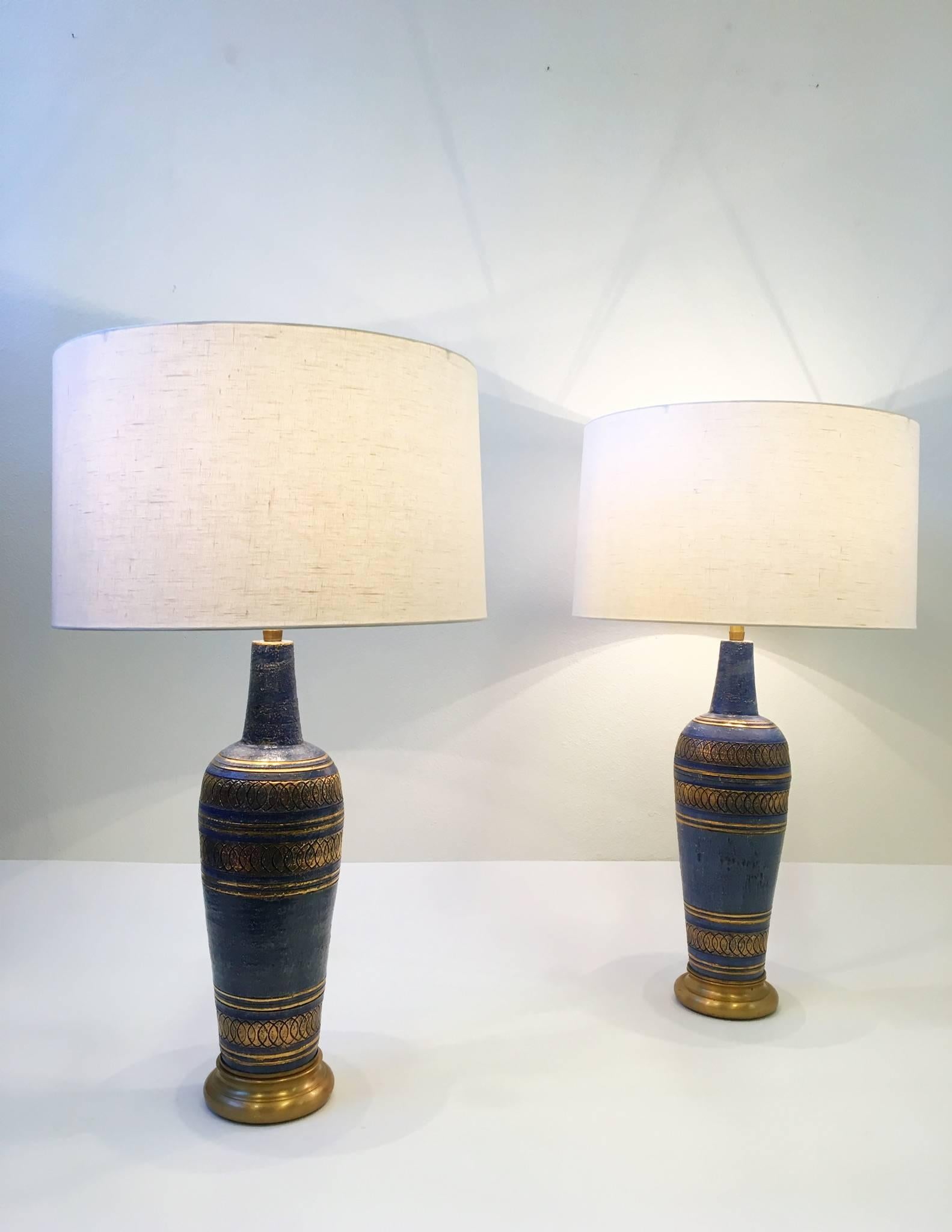 A spectacular pair of Italian ceramic and satin brass table lamps Designed by Guido Bitossi for Marbro. Some of the detail designed was outlined with real gold. The lamps have been newly rewired with new brown cloth cord.
New vanilla linen