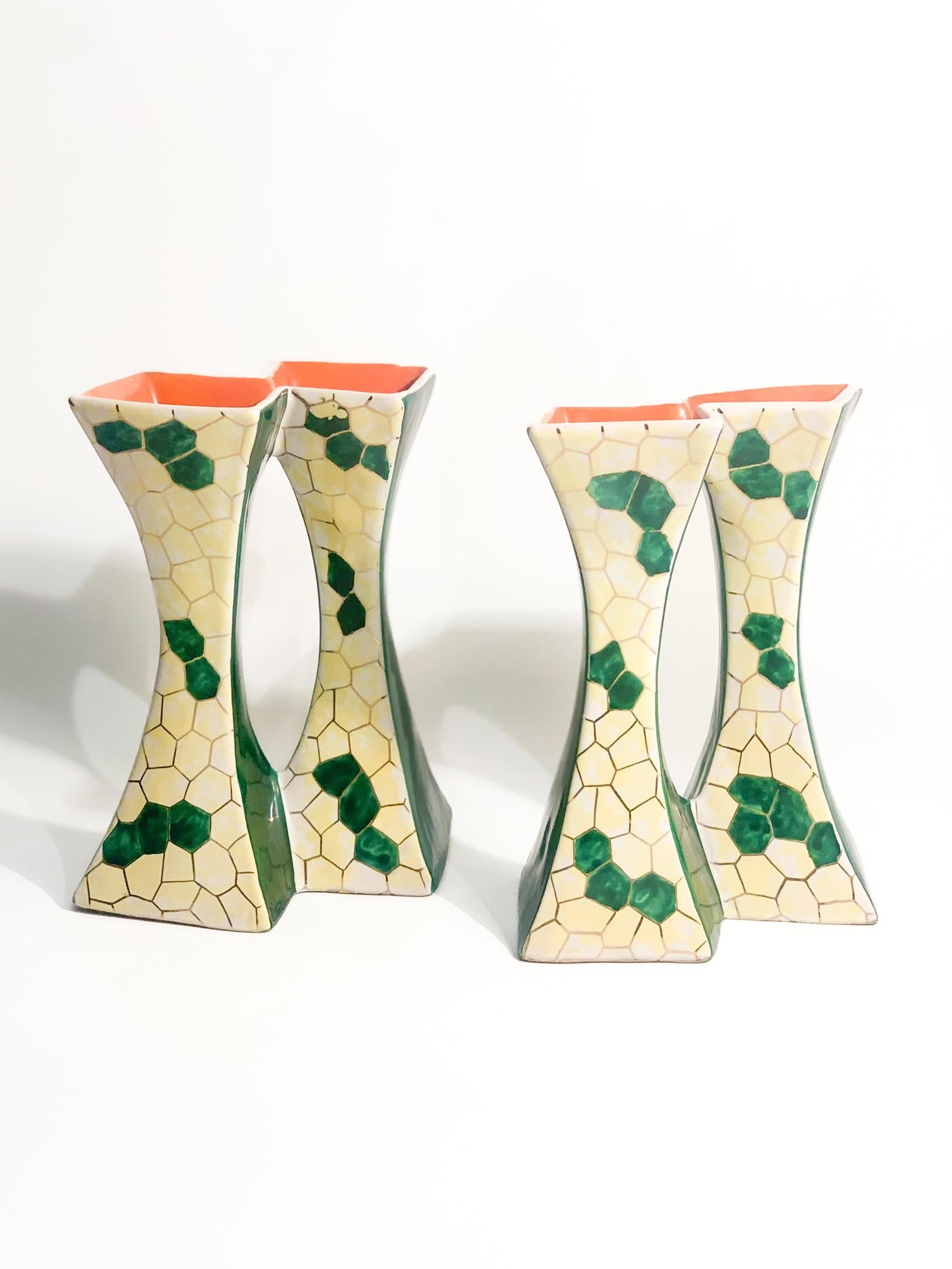 Pair of ceramic candle holders (4 wind instruments) hand painted in green, orange and yellow, made by Pucci Umbertide in the 1950s

Ø 17 cm h 19 cm

One of the candle holder ha a little chip at the top, has shown in the pictures. Additional pictures