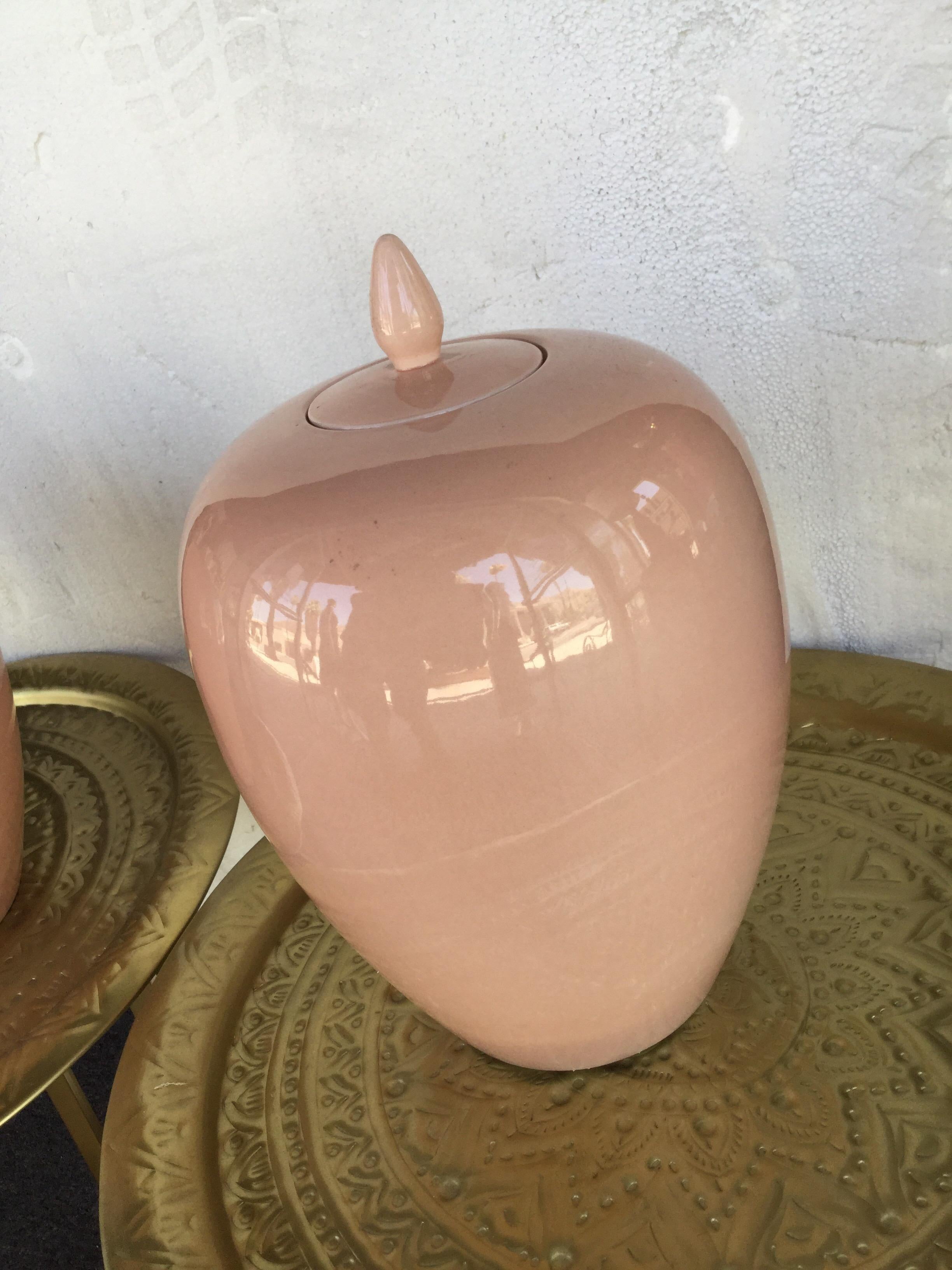 A rare pair of matching Italian ceramic ginger jars with their lids from a vintage designer Palm Springs estate. Signed Italy. Purchased in Italy in the 1960s.