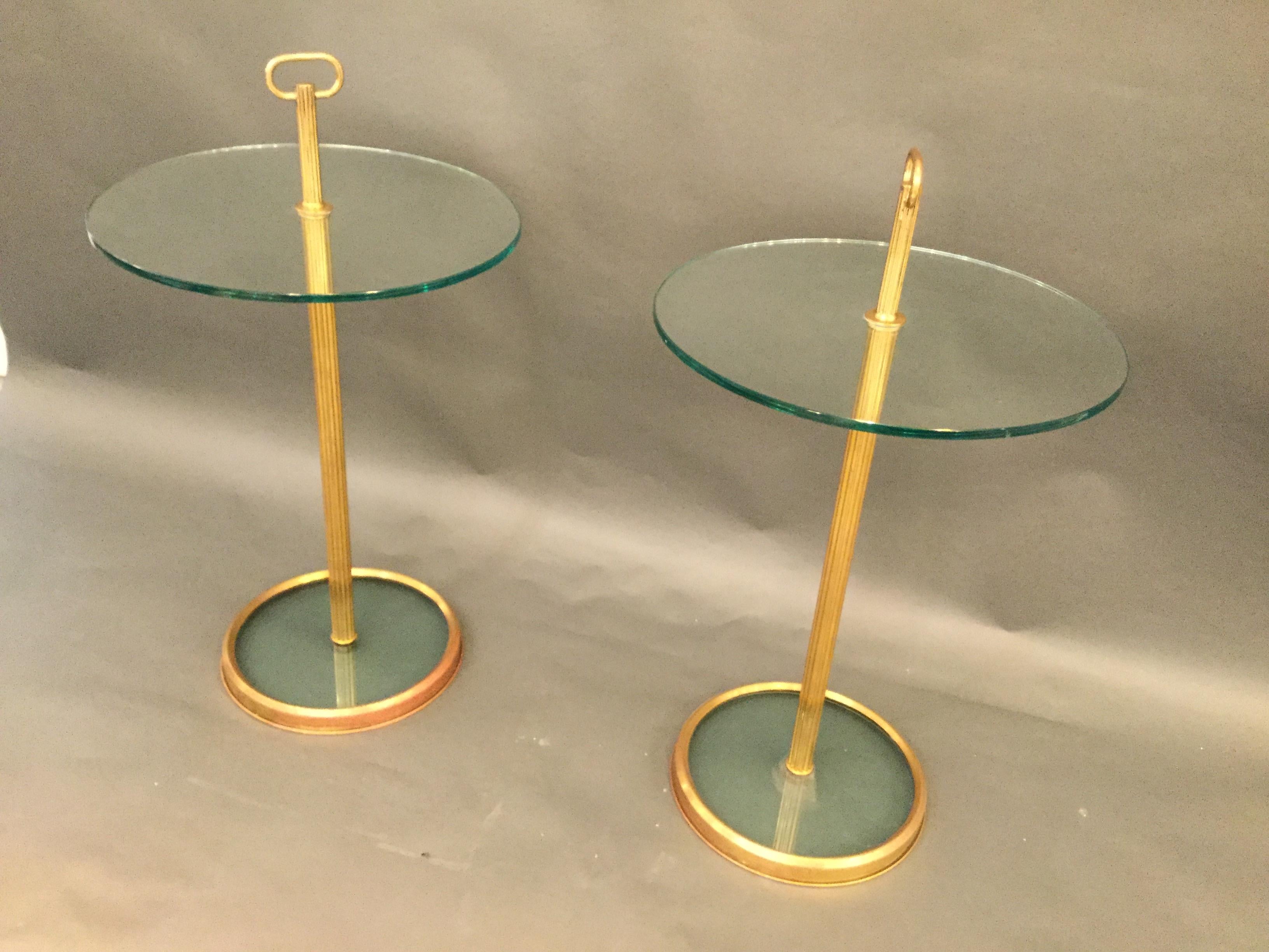 A pair of circular Italian designed cocktail tables in brass and glass style of Fontana Arte.