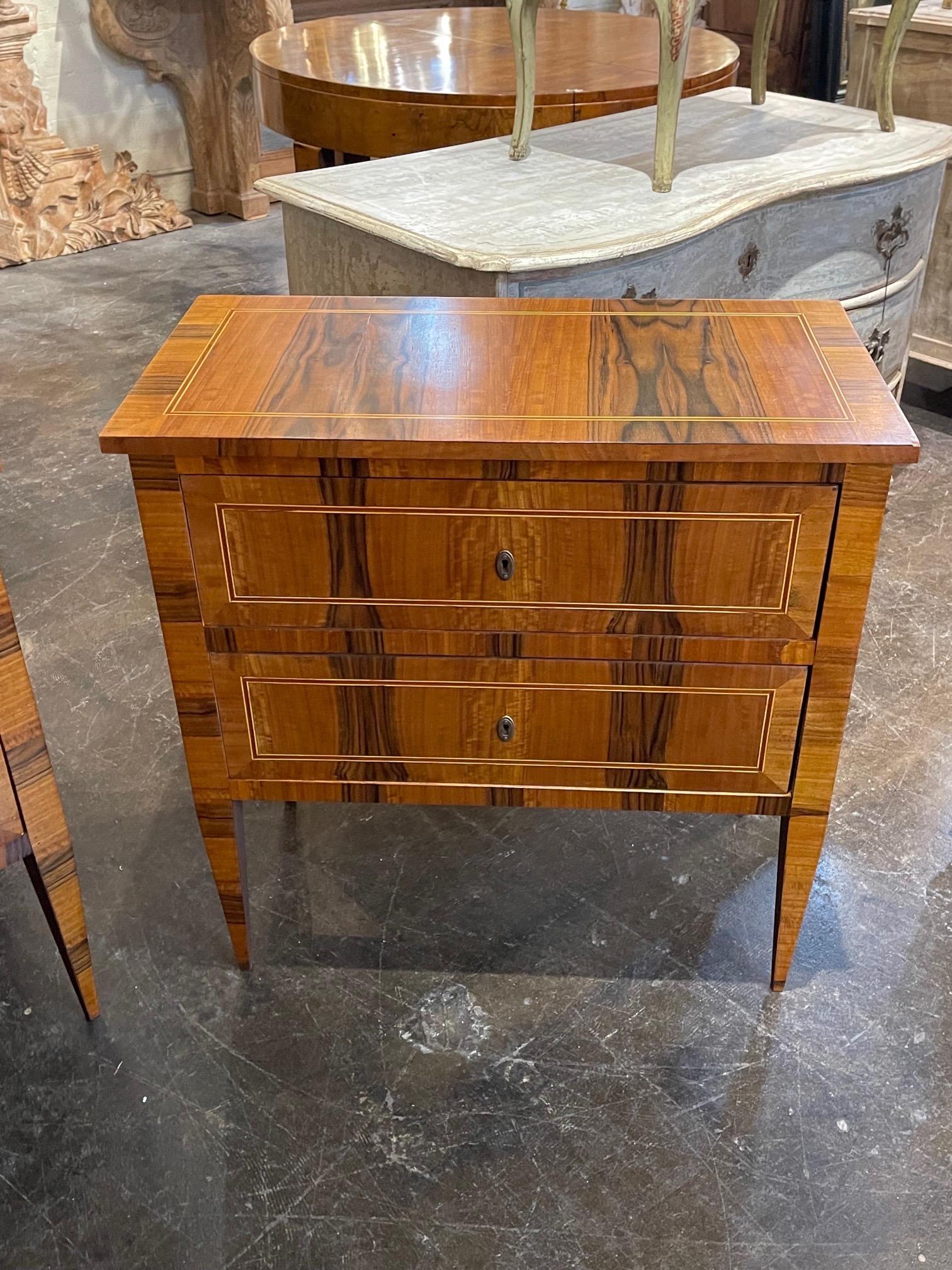 Handsome pair of custom veneer bedside tables from Italy. The set creates a very polished look and has a nice inlaid pattern. Lovely!