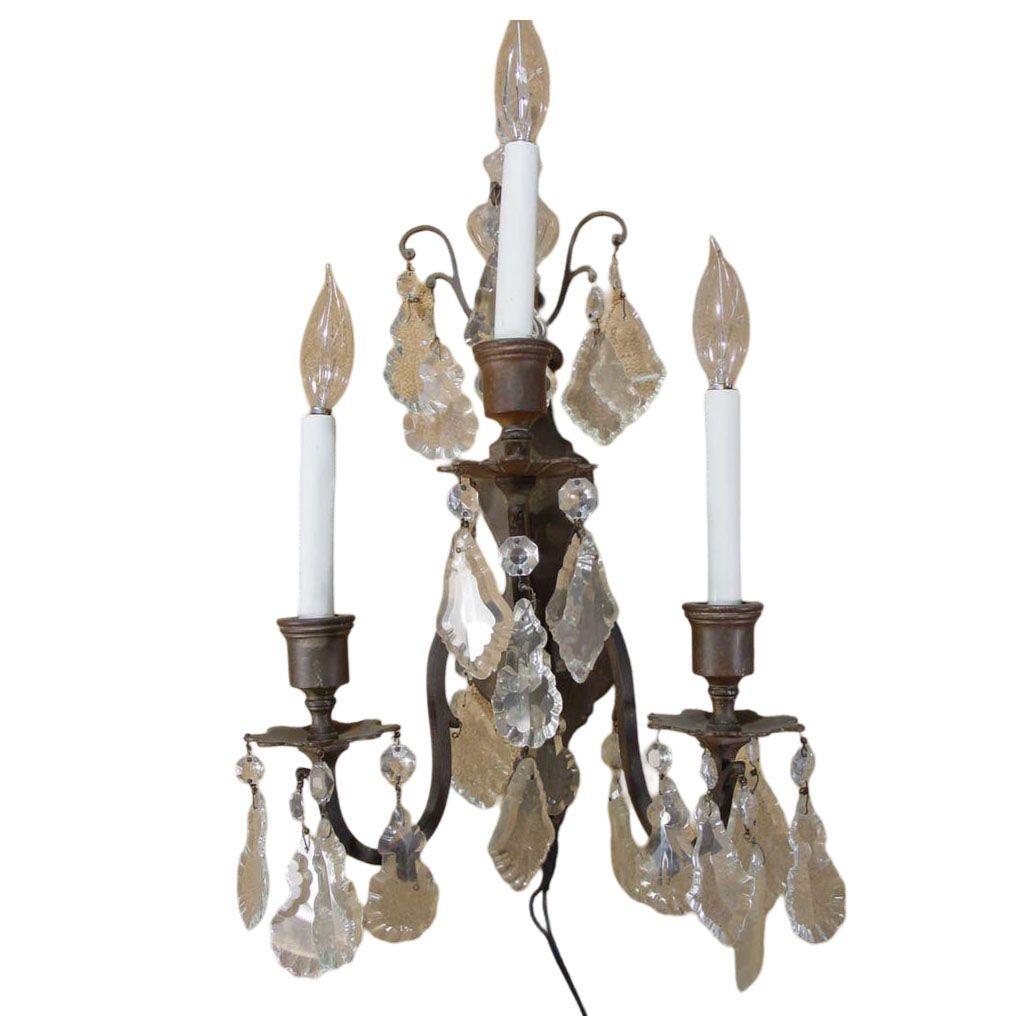 Pair of Italian bronze and crystal wall sconces featuring beautifully cut crystal beads and accents. Each sconce has three lights.

 