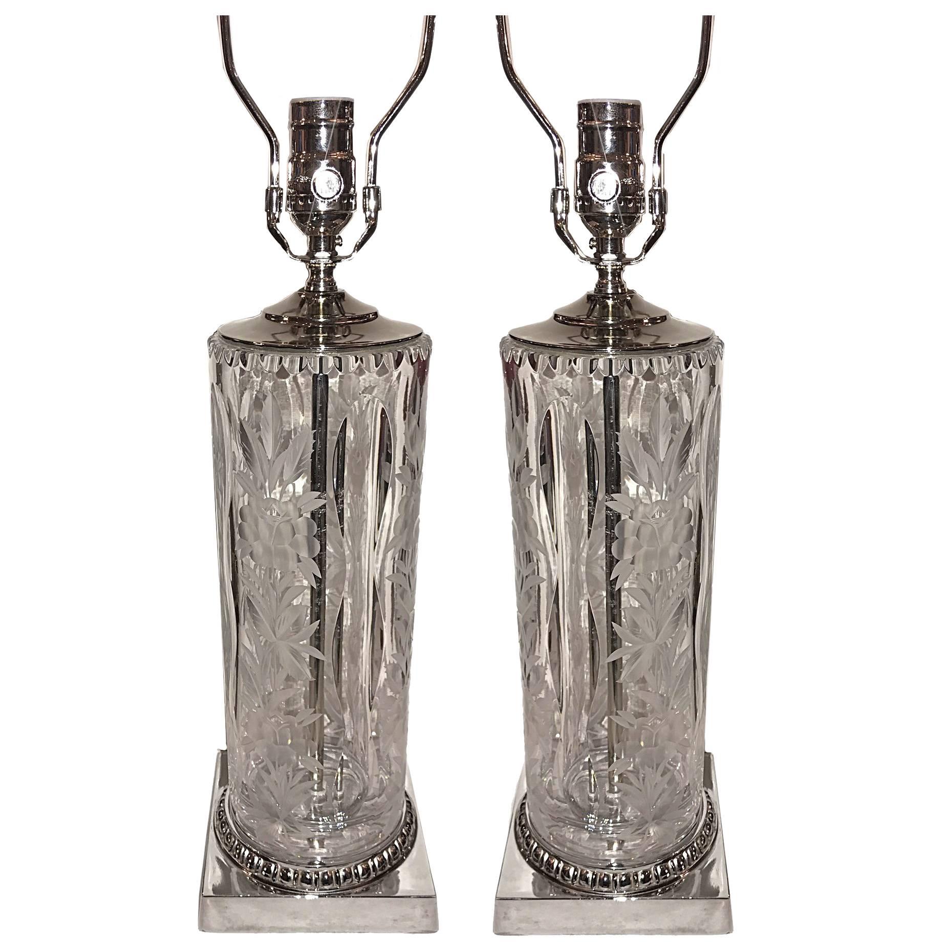 A pair of circa 1940's Italian cut glass table lamps with floral motif and silver bases.

Measurements
Height of body: 15