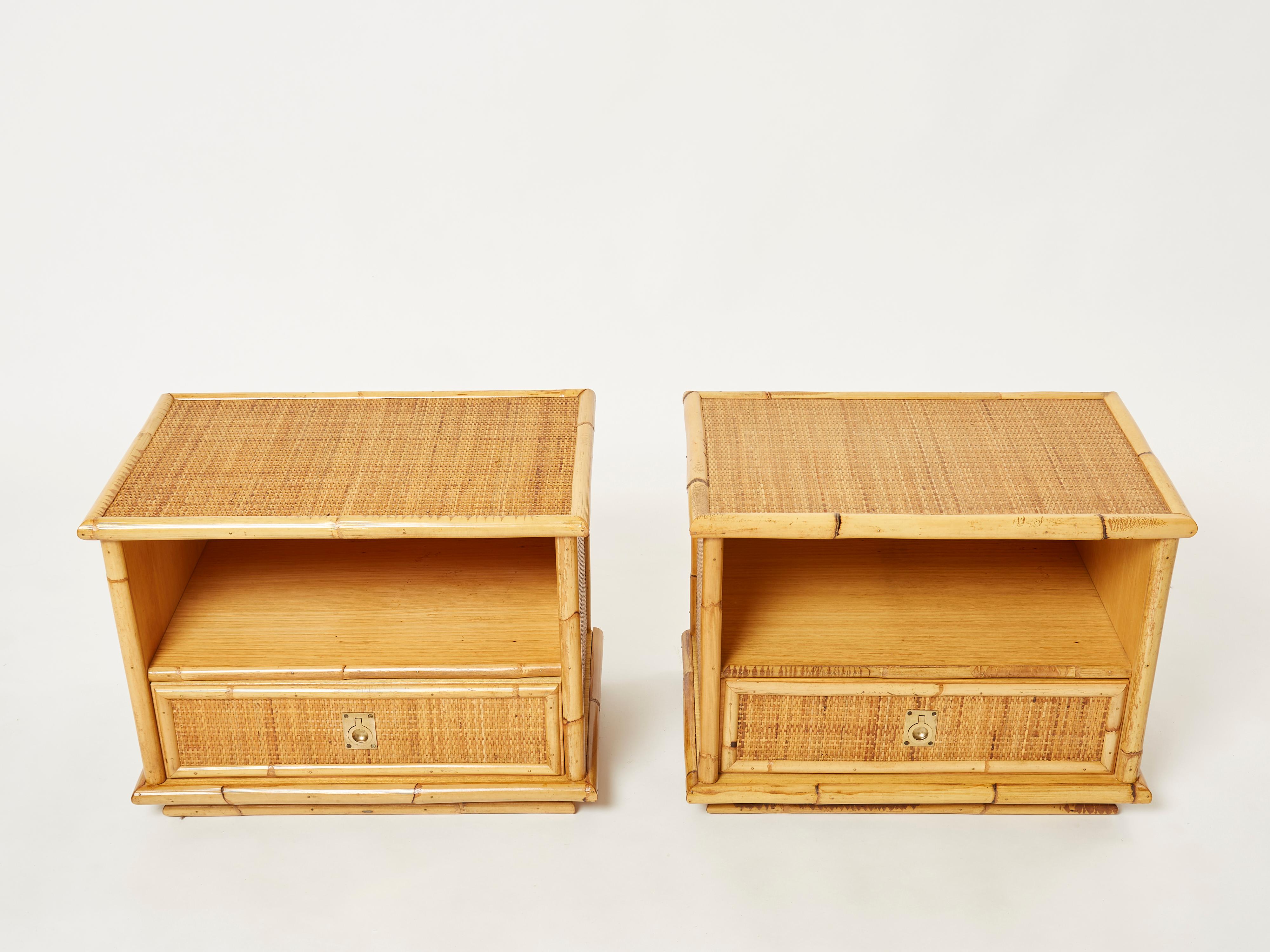 Natural bamboo as the chief material creates a summery, organic aesthetic in these 1970’s night stands, or end tables, while bright brass handles are strong, adding eye-catching touches. The brass handles on the drawers are lovely examples of