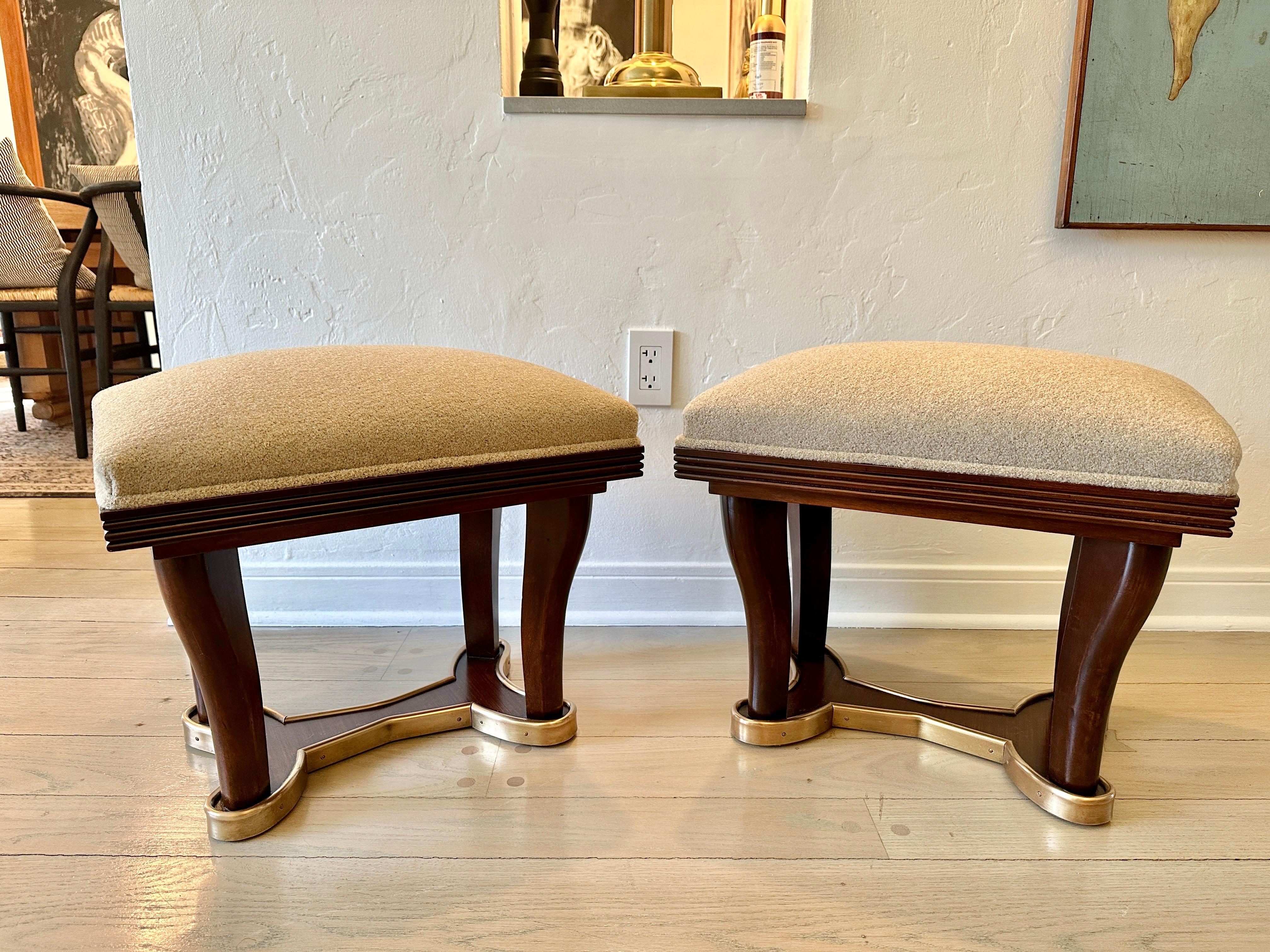 Reupholstered in a luxurious cashmere/wool blend fabric in camel tone, these Art Deco benches feature channel wood trim to top edge and a brass wrapped base. Phenomenal style and elegance!.