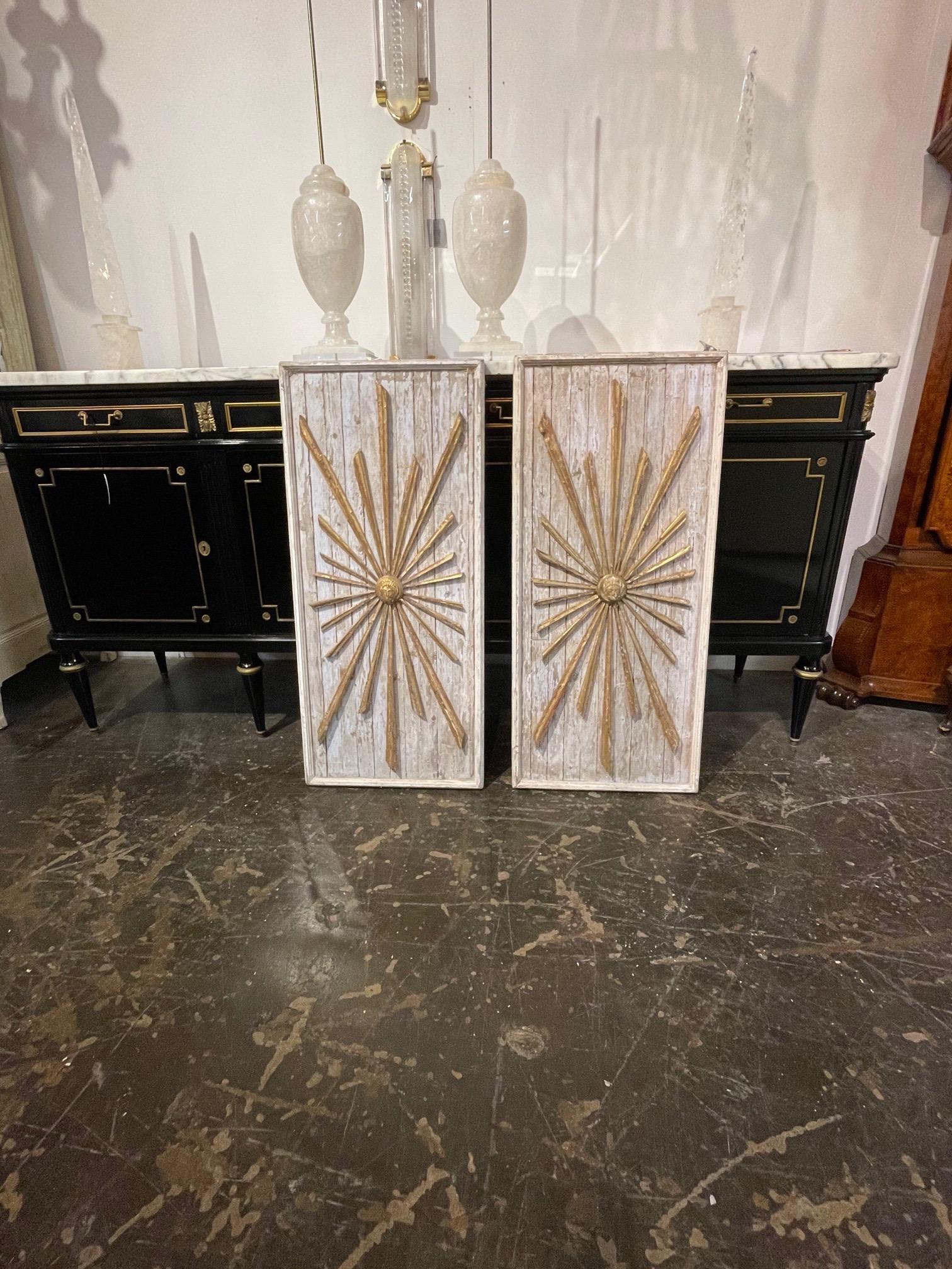 Beautiful pair of Italian decorative parcel-gilt sunburst panels. Nice patina and carvings. A unique accessory!