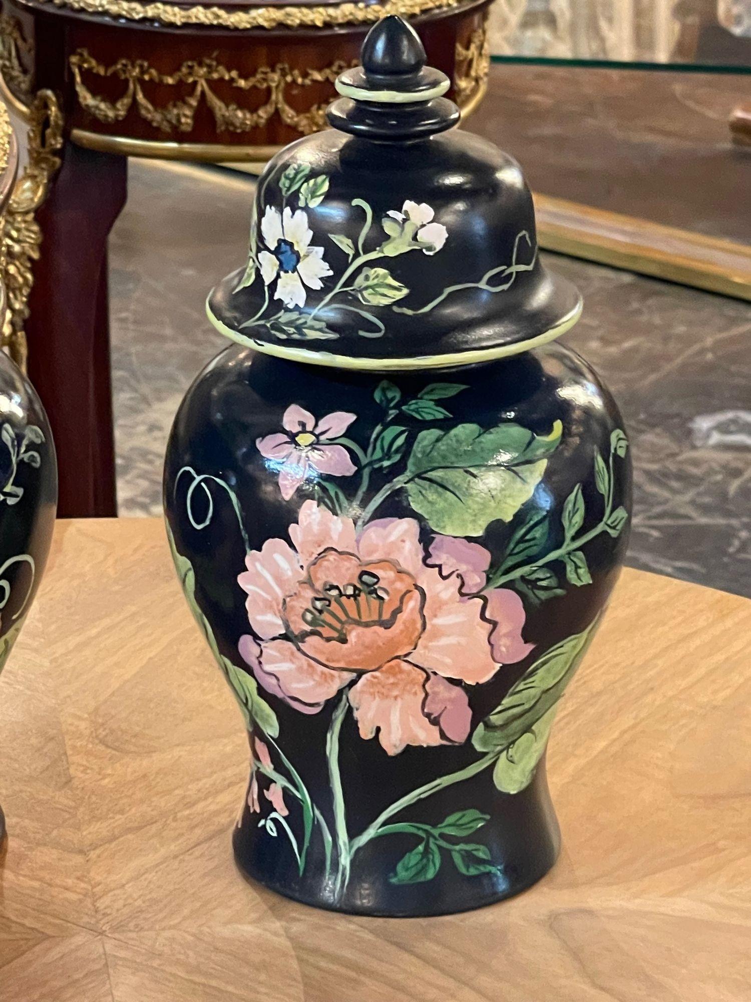 Beautiful pair of Italian porcelain vases with a decorative floral design. Makes a lovely accessory!
