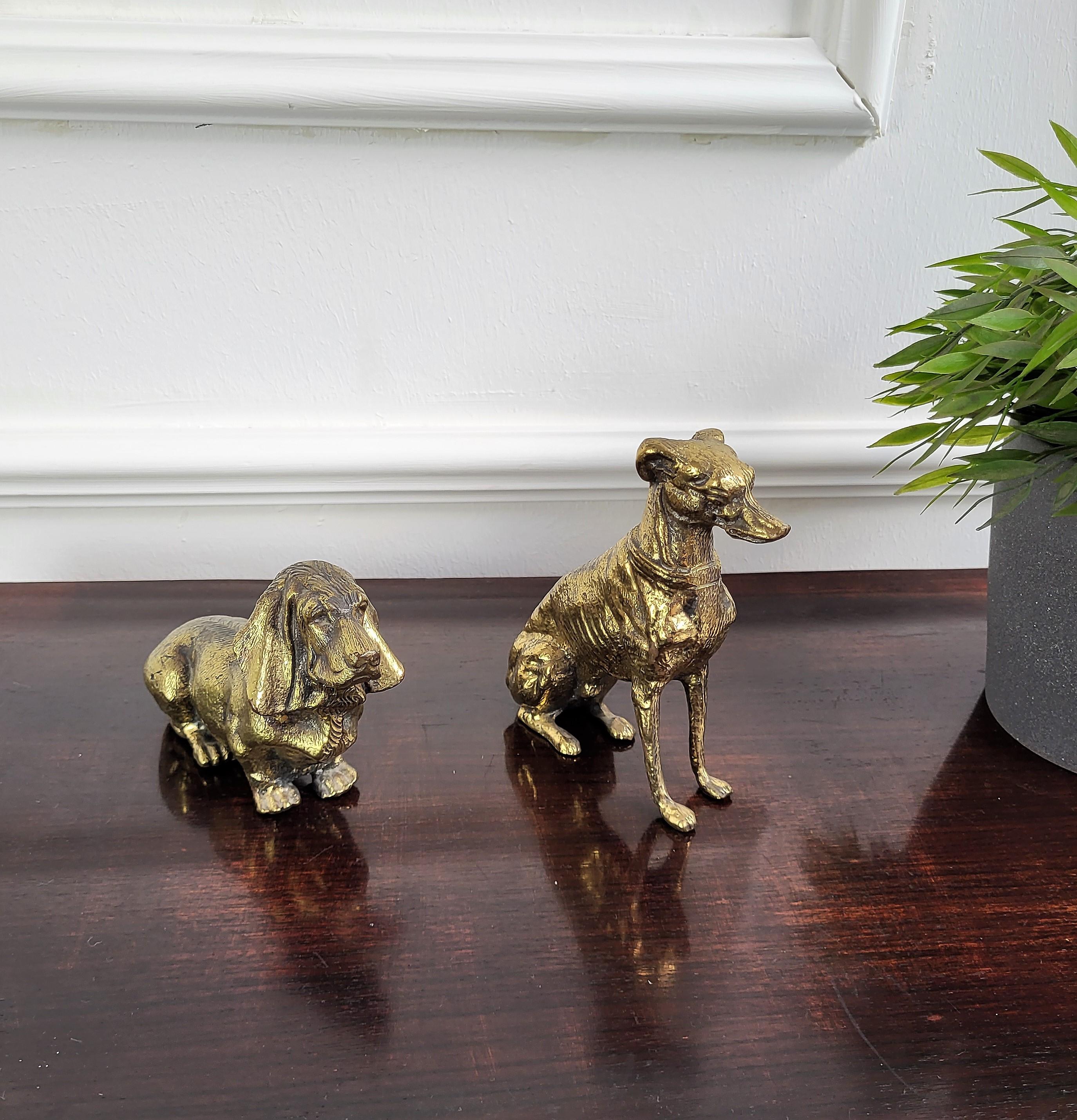 Pair of Italian desk top brass bronze dog sculptures ideal as decorative paperweights or eventually as book holders.