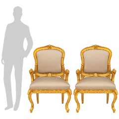 pair of Italian early 18th century Baroque Period Giltwood armchairs