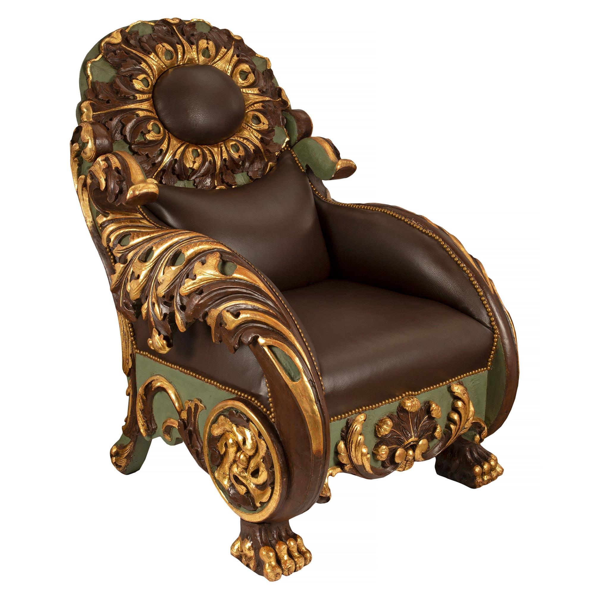 A sensational and extremely unique pair of Italian early 19th century Baroque polychrome and giltwood armchairs. Each rare armchair is raised by handsome polychrome paw feet with giltwood accents. Striking and large elaborate scrolls extend down