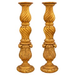 Paire de colonnes baroques italiennes en bois doré du début du XIXe siècle