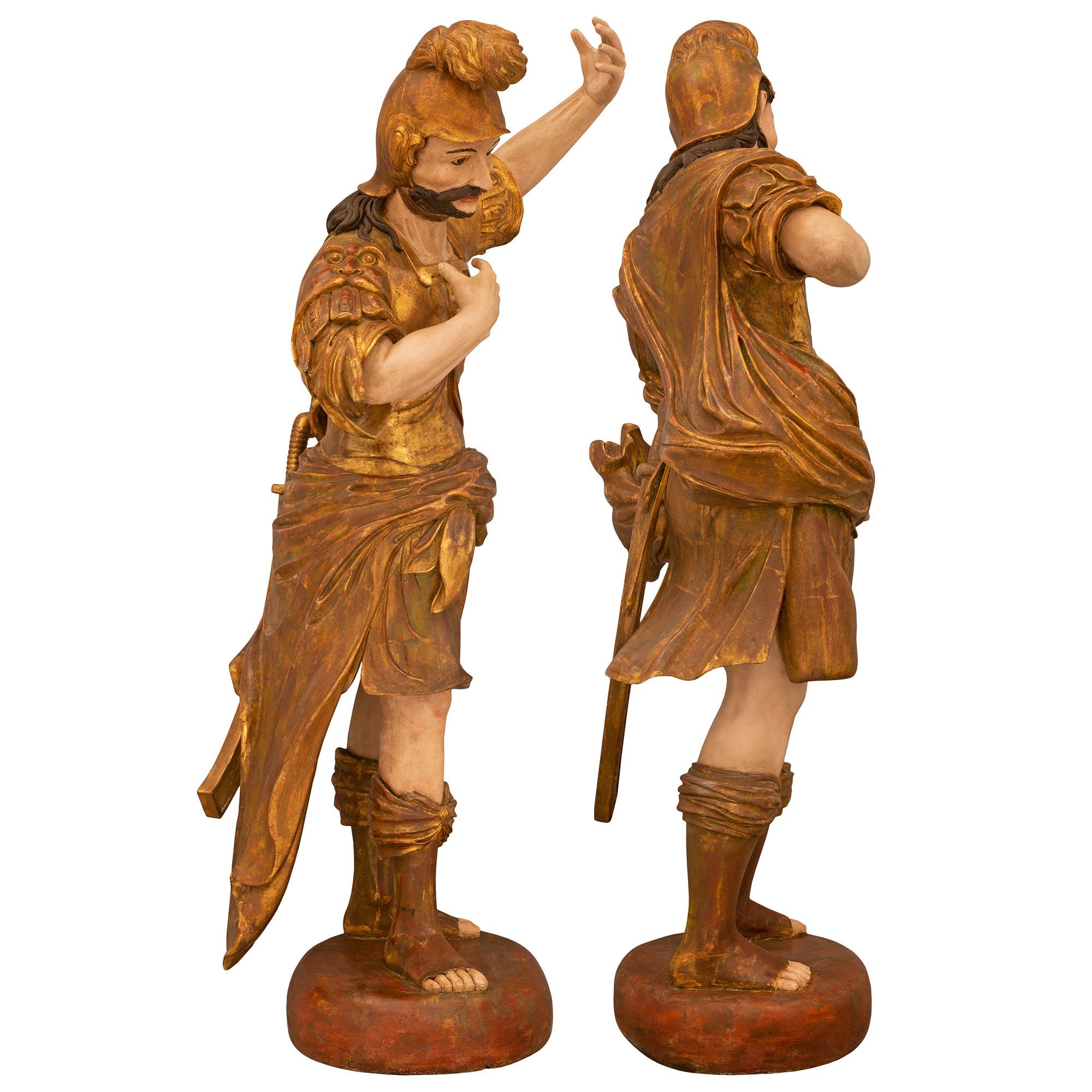 Patinated Pair of Italian Early 19th Century Large Scale Roman Theatrical Carved Statues For Sale