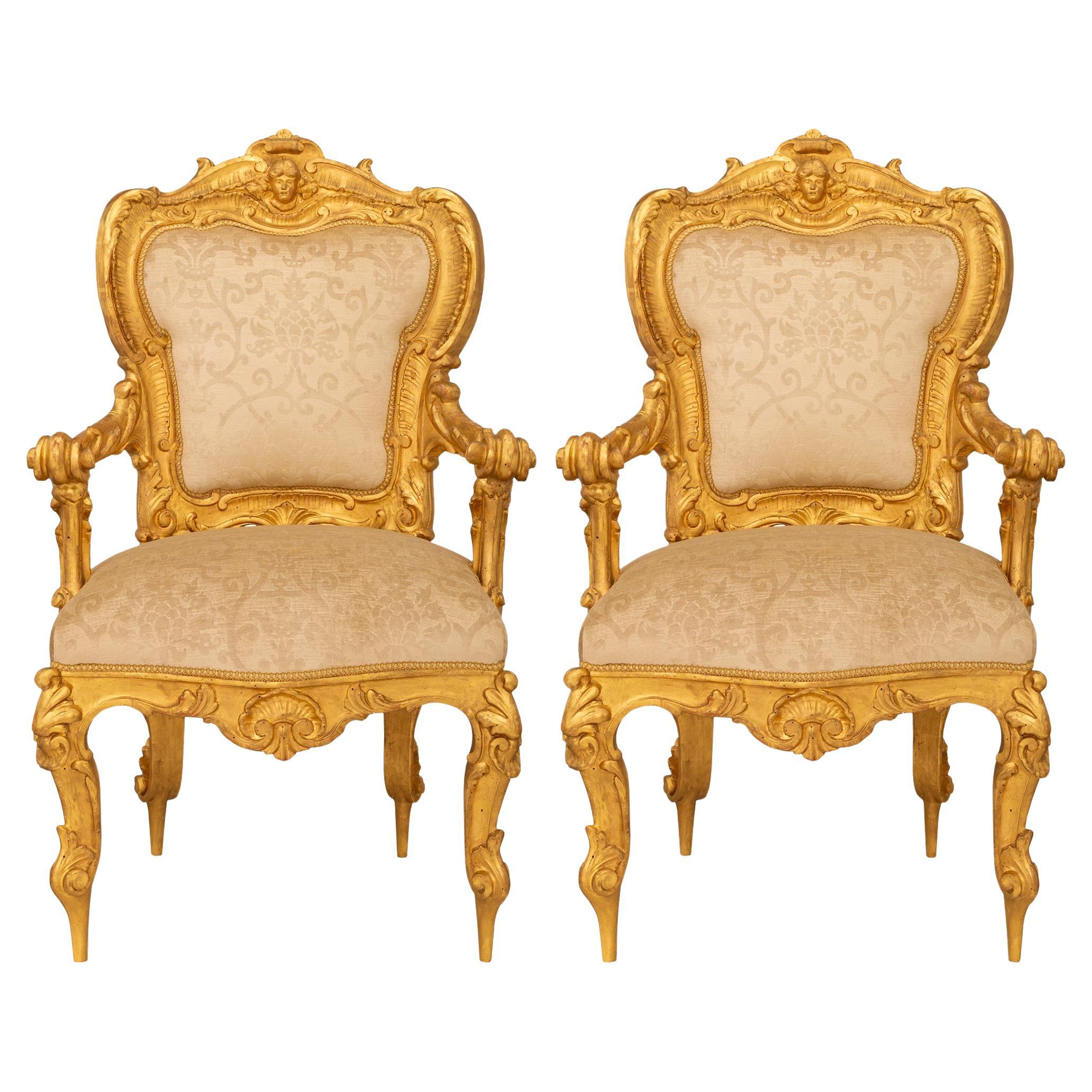pair of Italian early 19th century Louis XV st. Giltwood armchairs