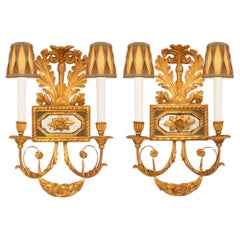 pair of Italian early 19th century Neo-Classical st. Giltwood mirrored sconces