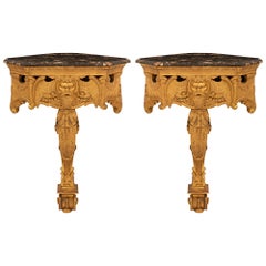 Coppia di console a muro in legno dorato del primo Ottocento italiano