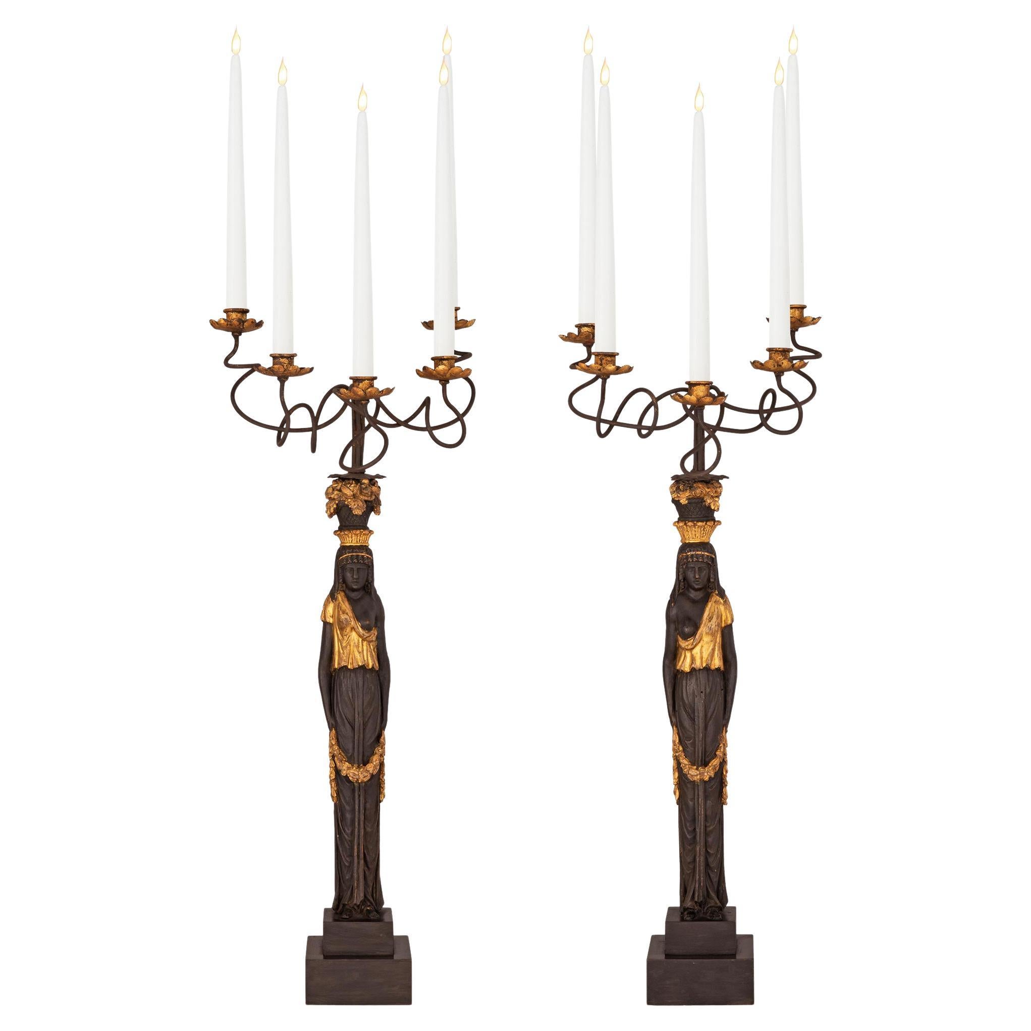 Pair of Italian Ebonized and Giltwood Maiden Five Arm Candelabras For Sale