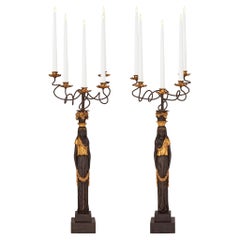 Pair of Italian Ebonized and Giltwood Maiden Five Arm Candelabras
