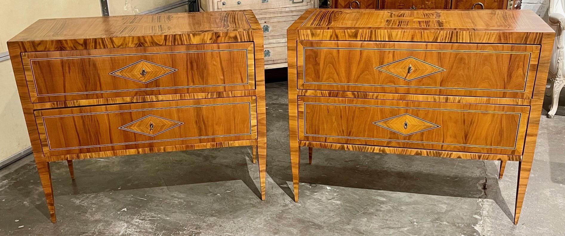 Handsome pair of Italian exotic veneer commodes inlaid with inlaid diamond pattern. Very fine wood polish and excellent craftsmanship. Superb!