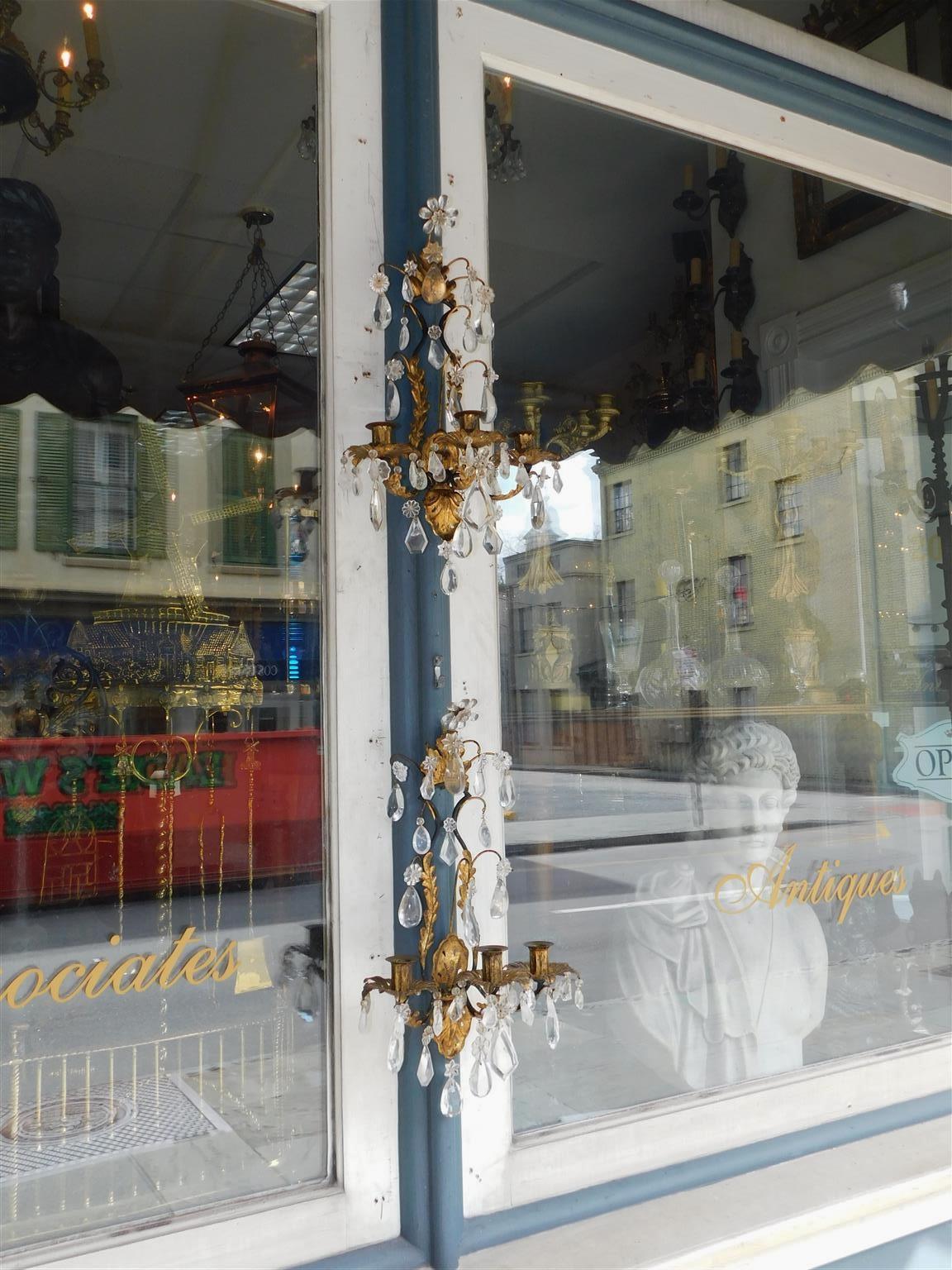 Pair of Italian foliage rock crystal and gilt three arm scrolled wall sconces. Early 19th Century. Sconces are candle powered and can be electrified if desired at no additional cost.