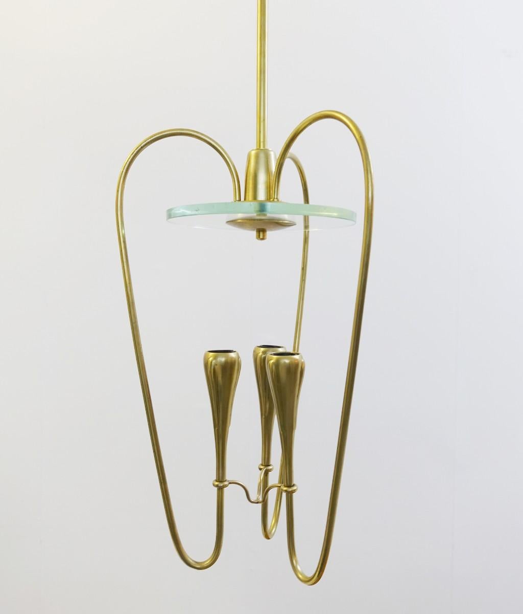 Pair of Italian Fontana Arte style brass and glass pendant light, Italy, 1970s.