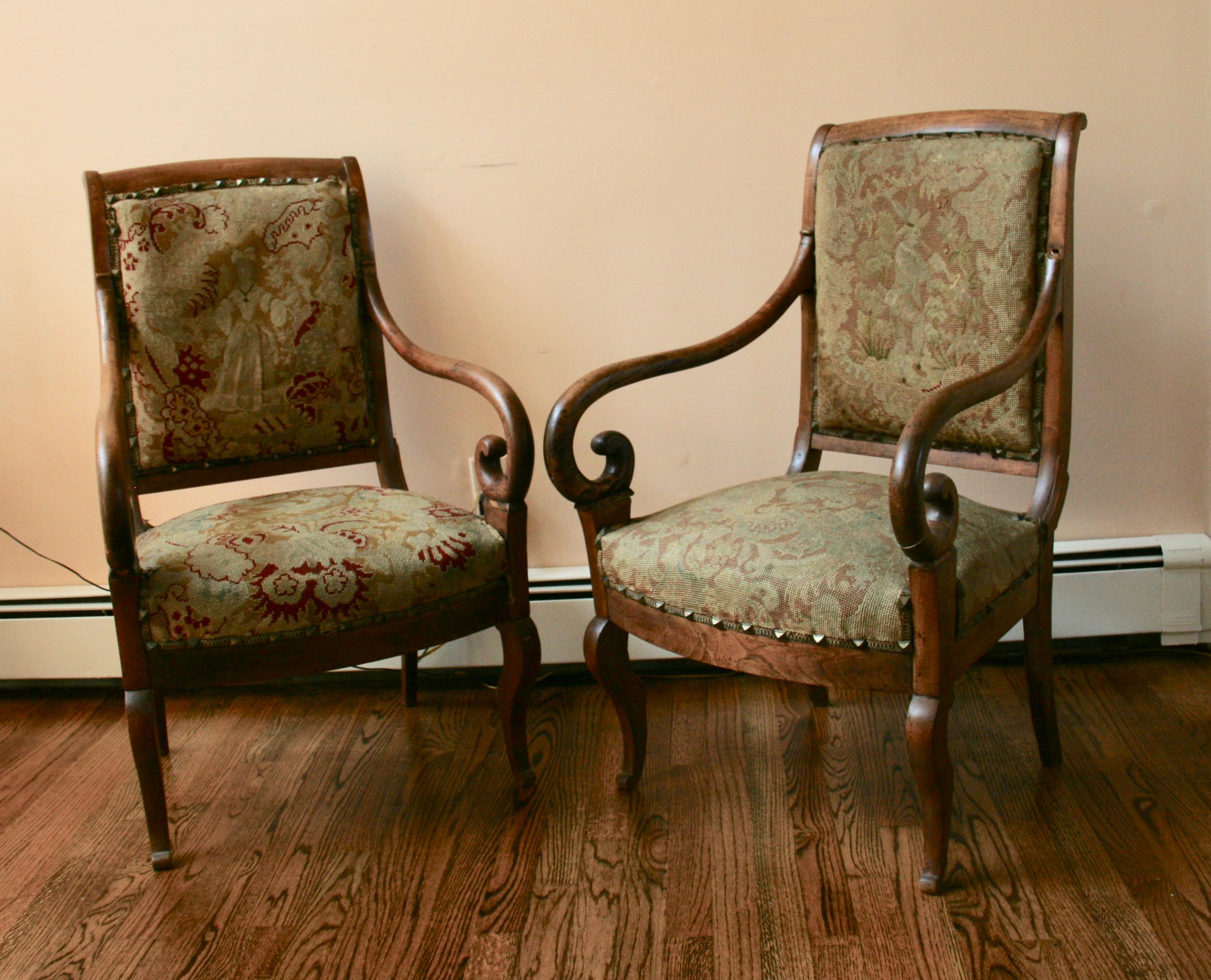 Pair of Italian fruitwood chairs, antique pair of beautifully curved fruitwood Italian with their original tapestry  upholstery. One chair presents more discoloration. Structurally sound, upholstery need restoration.
Repair to one arm
Missing small