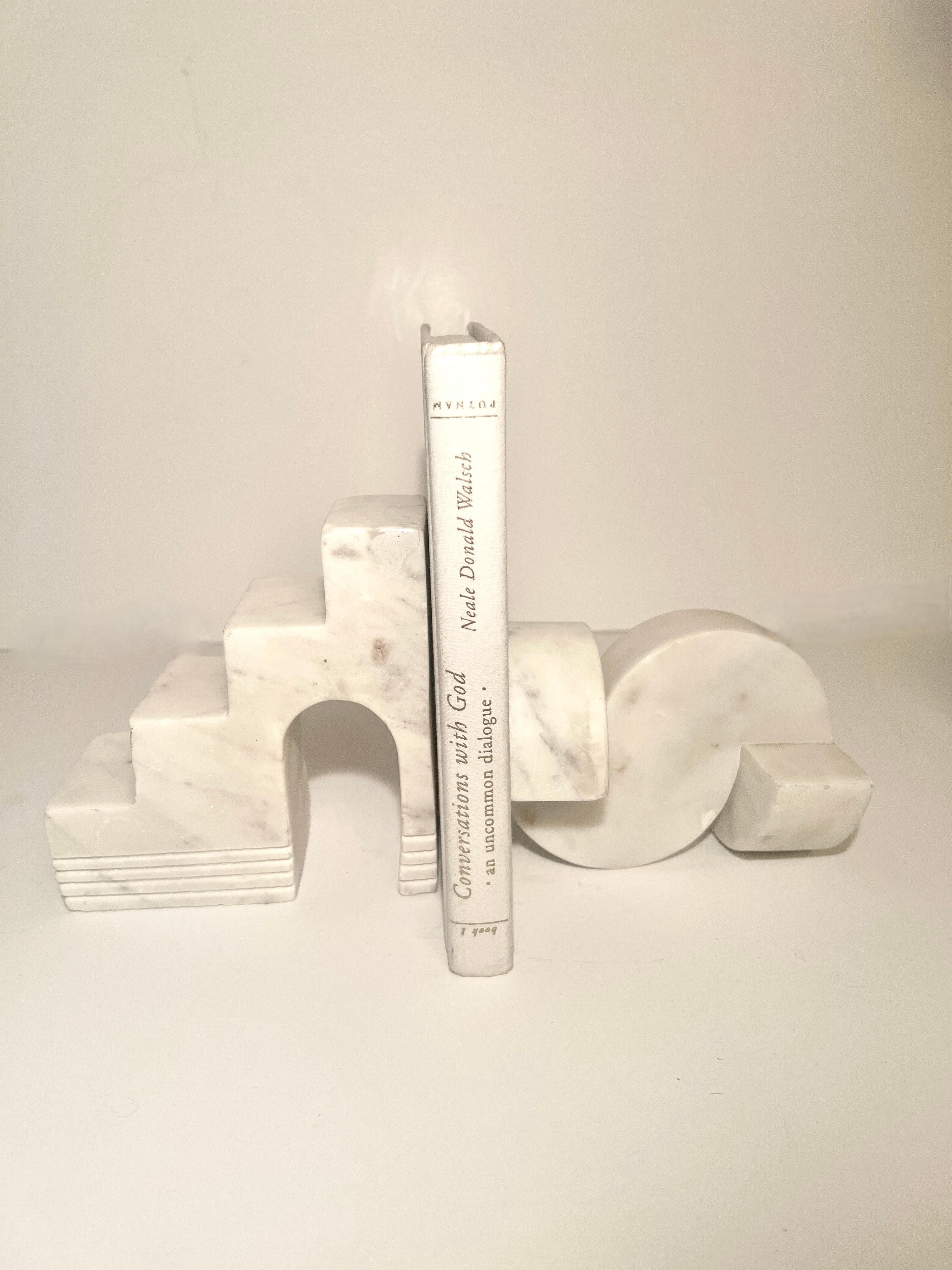 A pair of Carrara Marble Sculptures that can stand alone or work as bookends together or separately in the same space.   Here, you get two great pieces for one price.  These are also listed as separate pieces as they were not acquired together, but