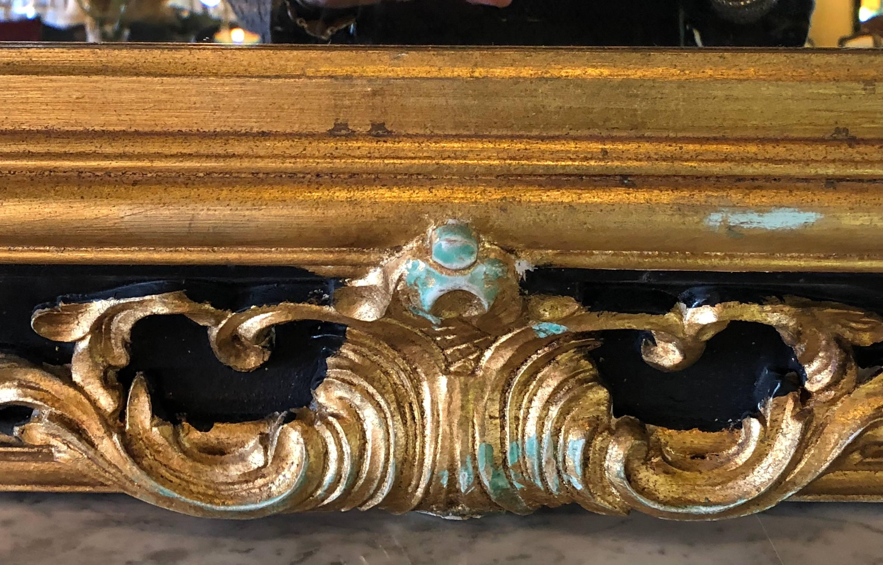 Pair of Italian Gilt and Ebony Beveled Monumental Console or Wall Mirrors 1