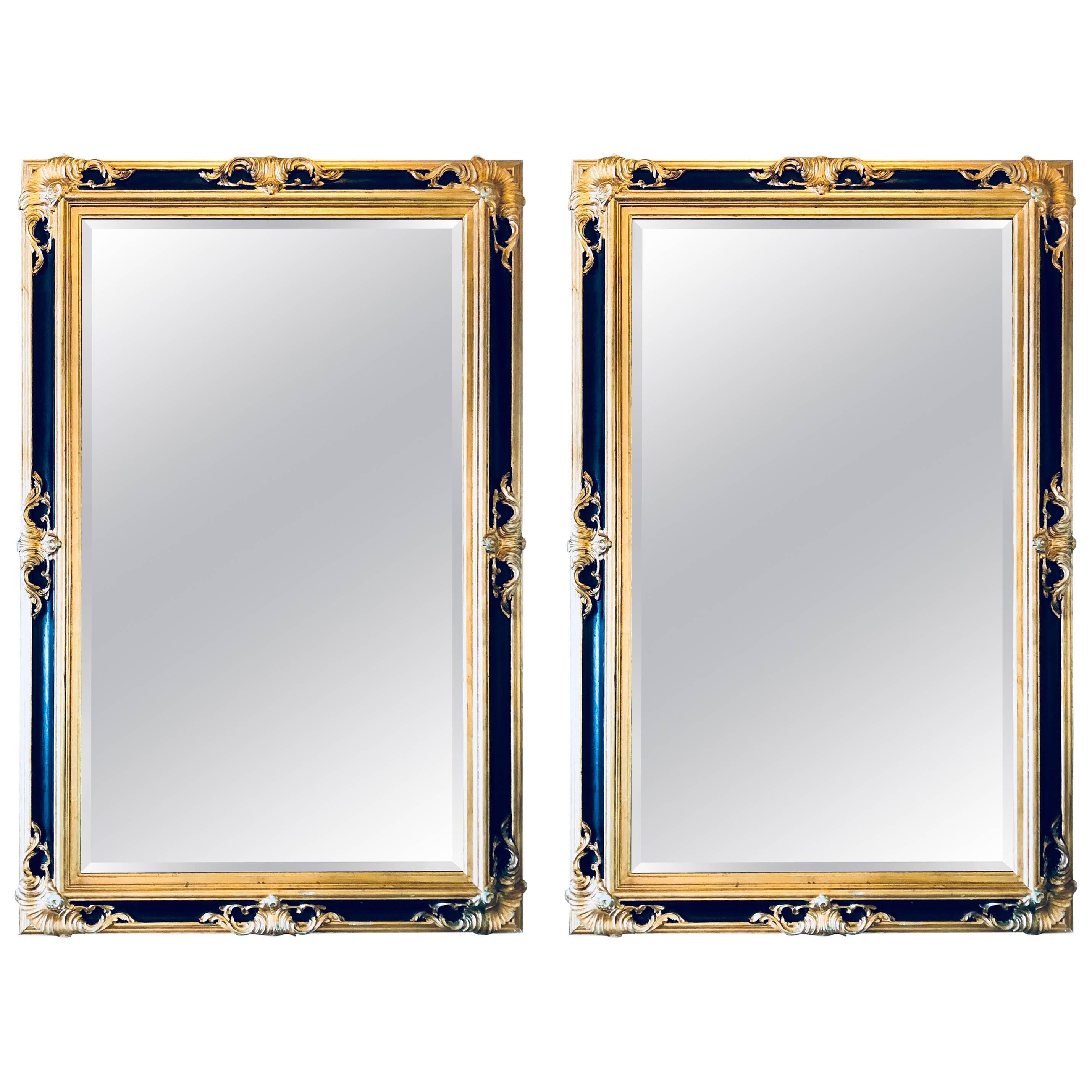 Pair of Italian Gilt and Ebony Beveled Monumental Console or Wall Mirrors