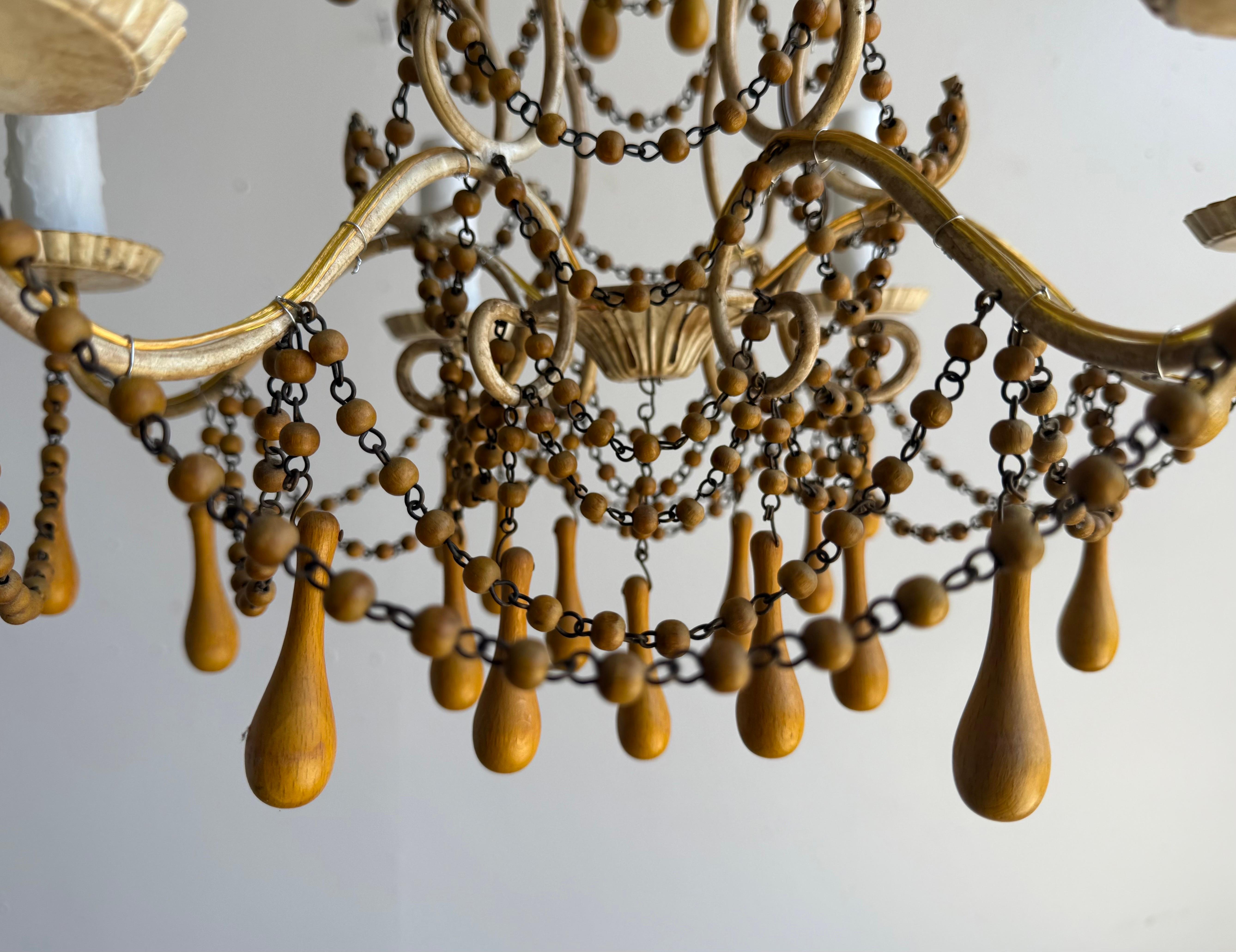 Pair of Italian Gilt Iron and Wood Beaded Chandeliers, Mid-20th Century In Good Condition For Sale In Los Angeles, CA