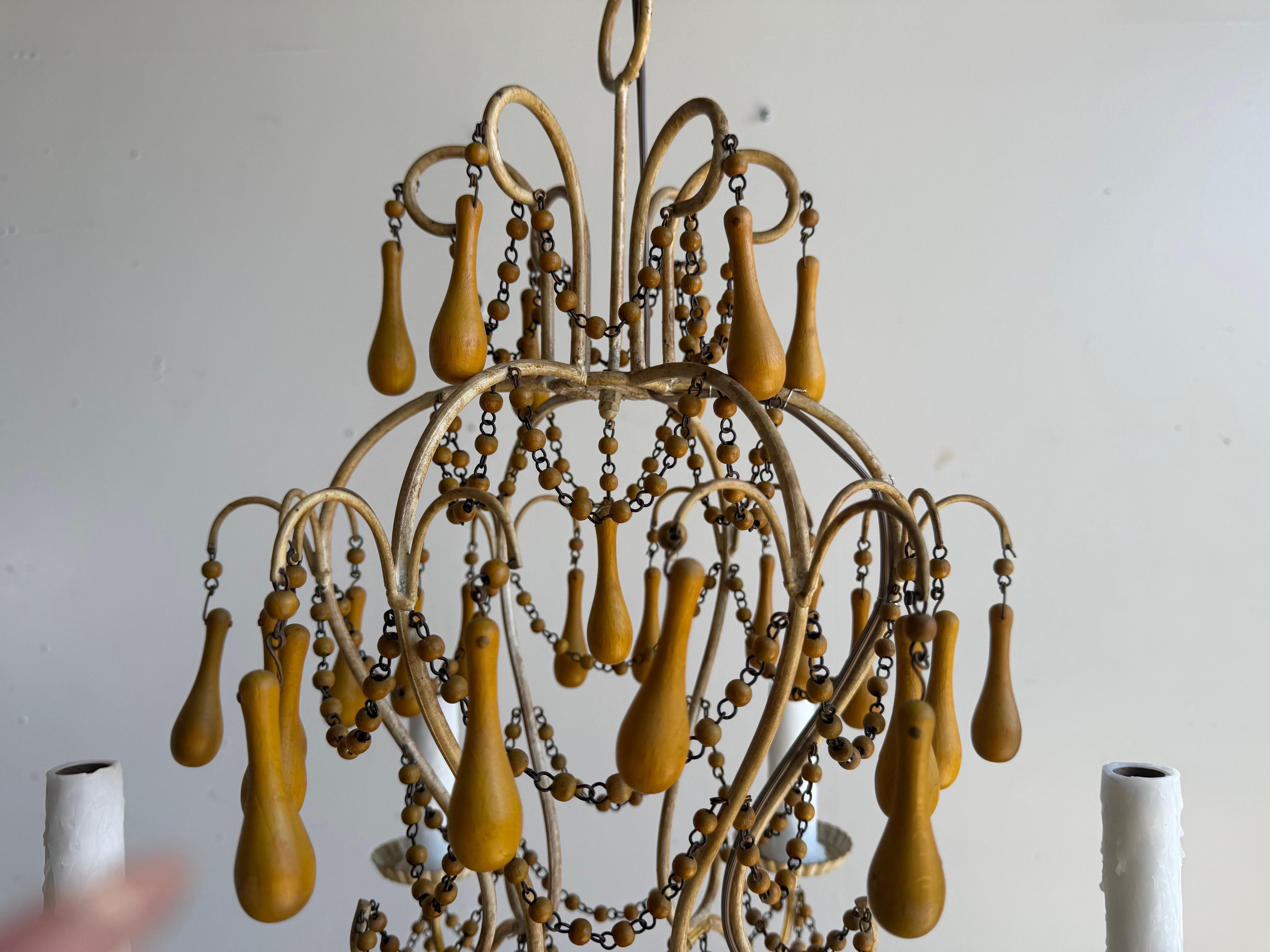 Metal Pair of Italian Gilt Iron and Wood Beaded Chandeliers, Mid-20th Century For Sale