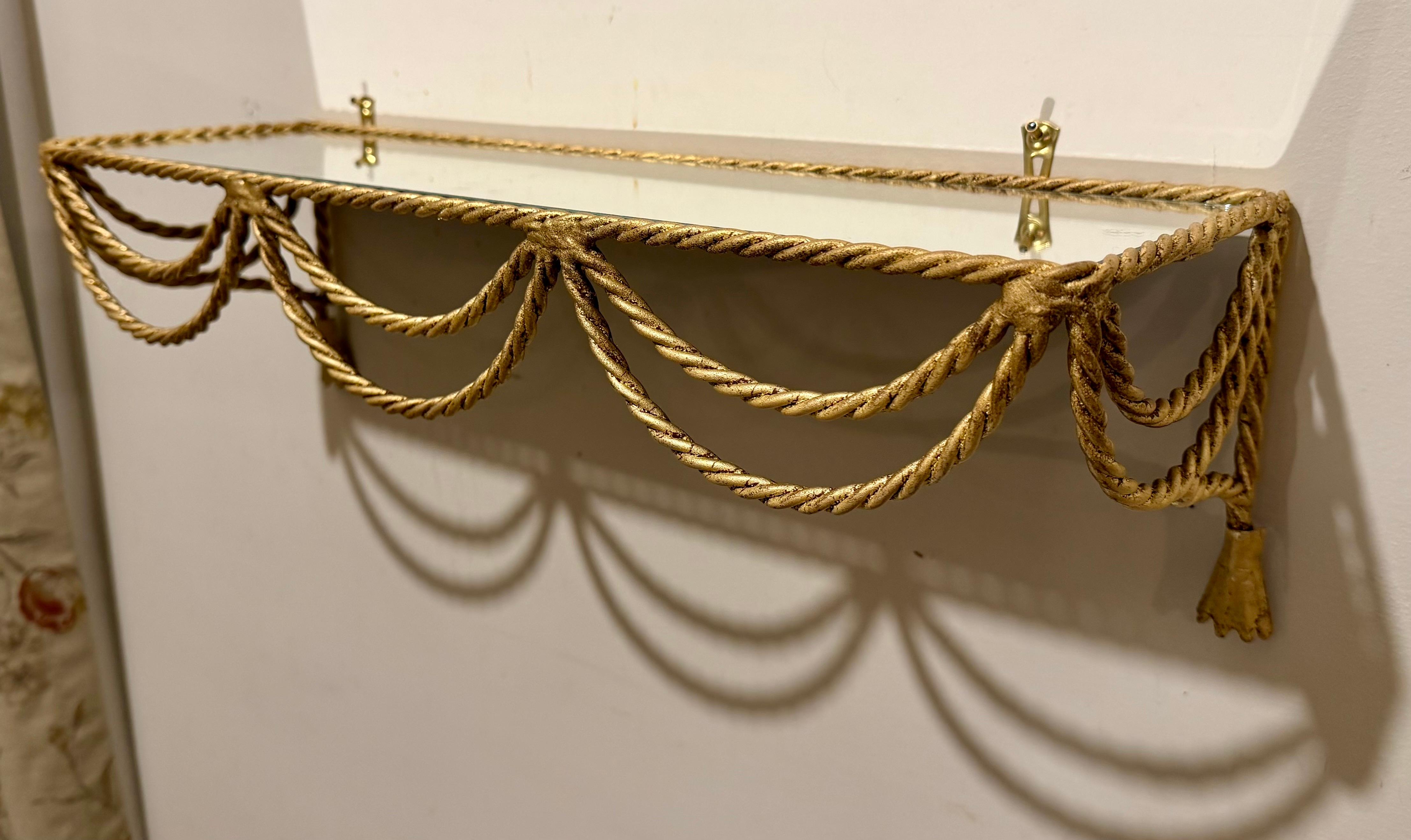 Pair Italian Gilt Rope and Tassel Wall Shelves with new glass. Scrolled sides. Perfect for bathroom,  Very sturdy and stylish