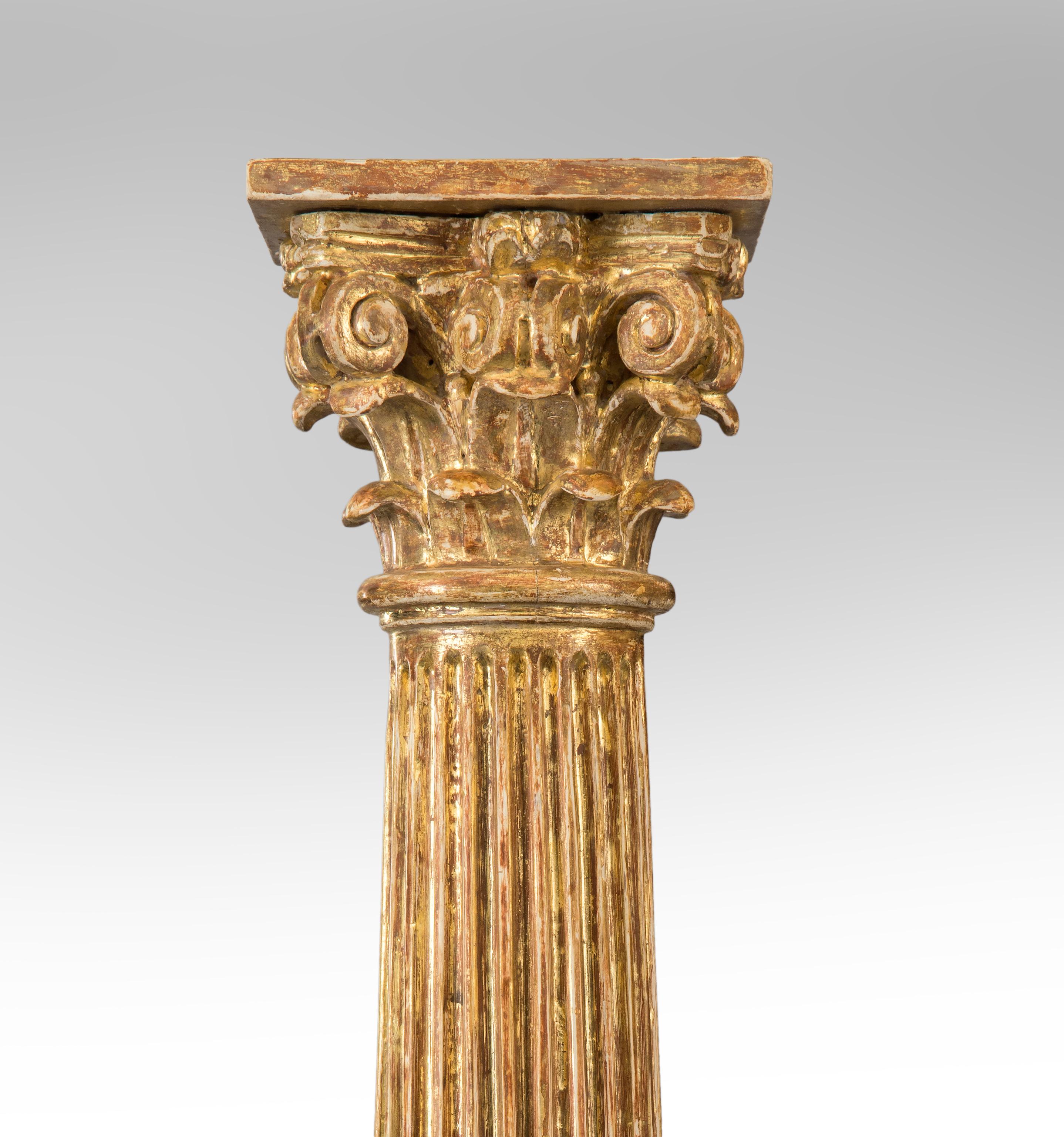 Pair of Italian giltwood Classical columns
18th or 19th century
These large giltwood columns standing on tall bases add gravitas and style to any room. The beautifully carved Corinthian capital above a fluted column on a stepped base adorned with