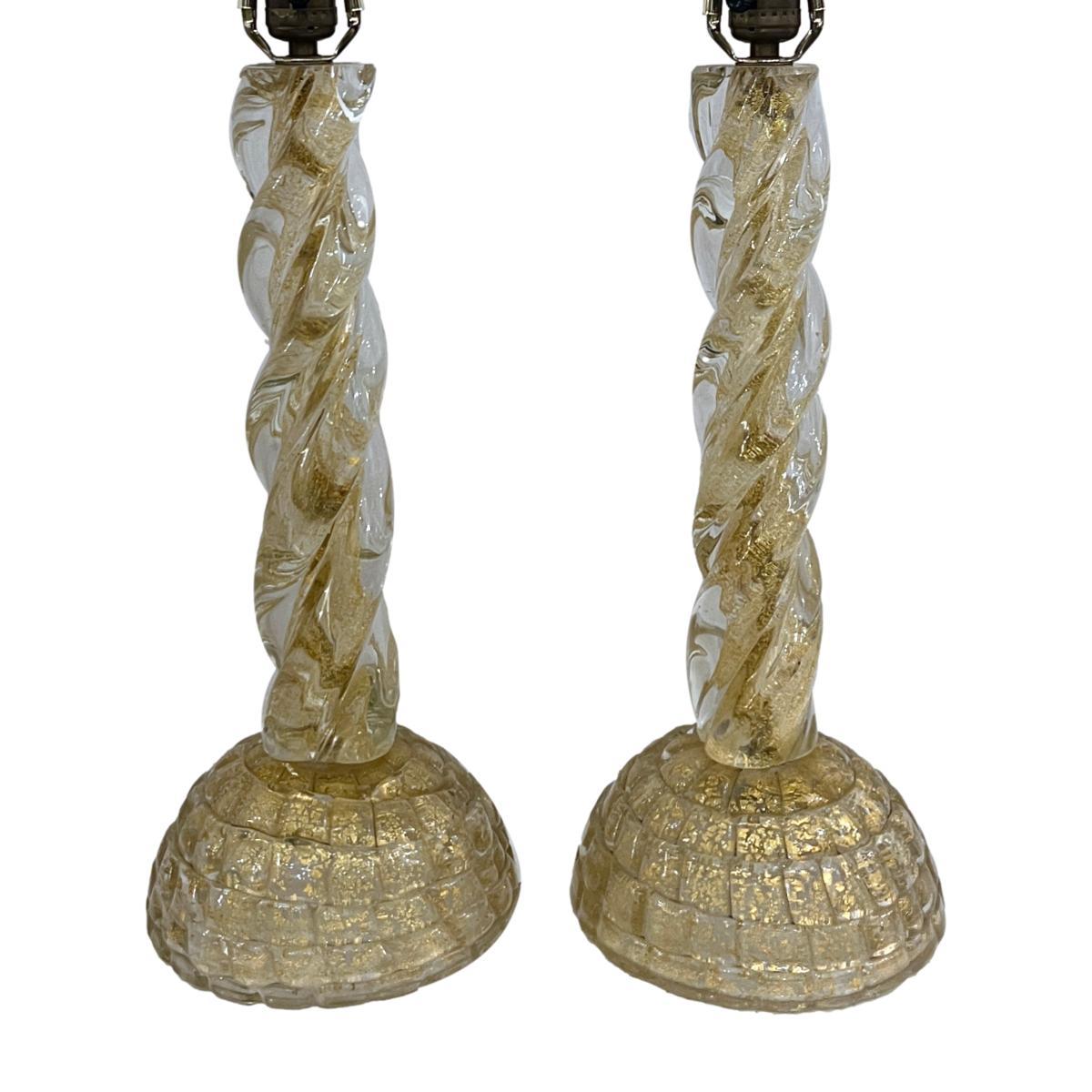 Pair of circa 1940's Italian Barovier Murano glass lamps with gold inset in clear twisted glass columns.

Measurements:
Height of body: 17.5