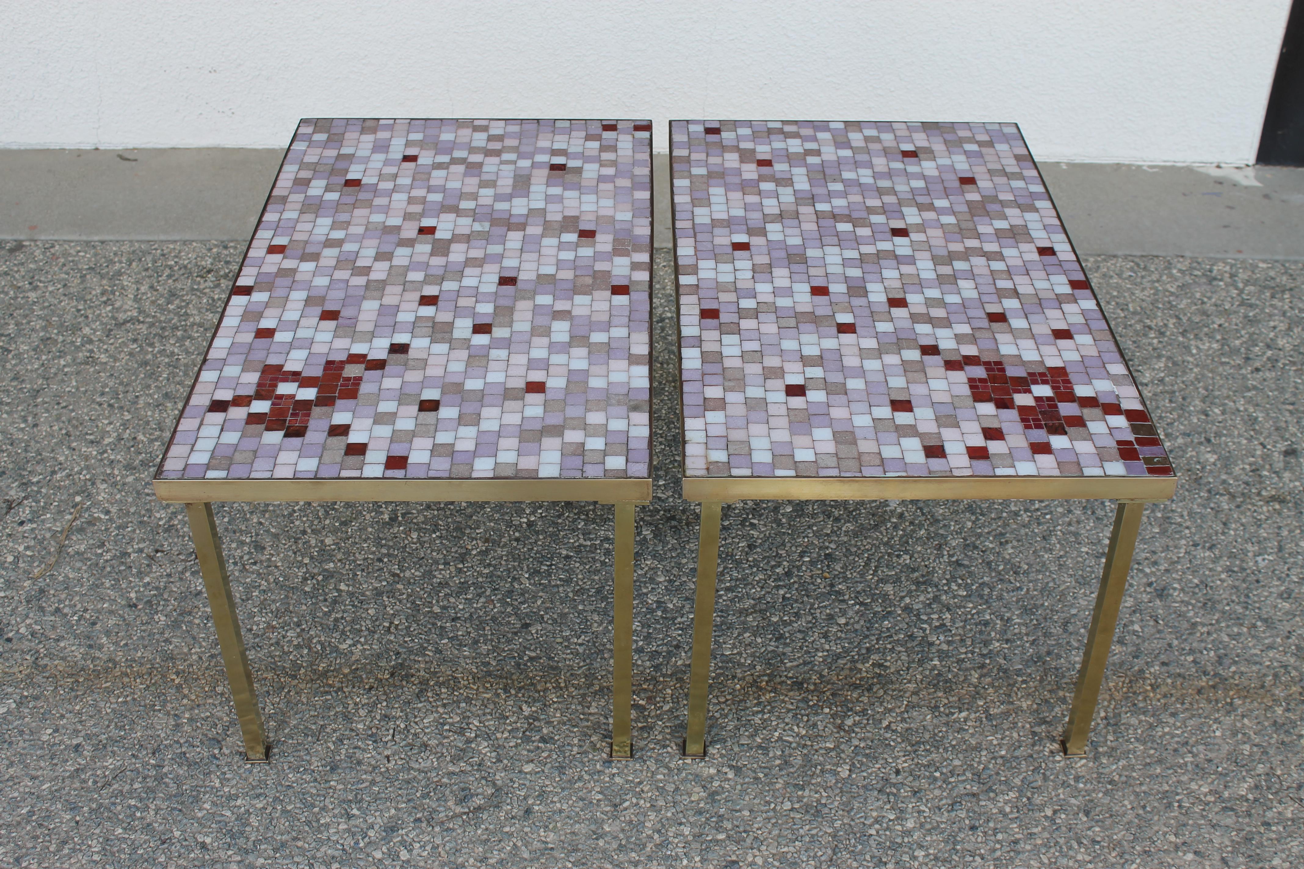 Pair of Modernist glass tile top brass side tables. Brass frame and square tube legs. Colored glass tiles in lavender, white, pink, and rust. Perfect to use as end tables or together as a coffee table. Each table measures 30.25