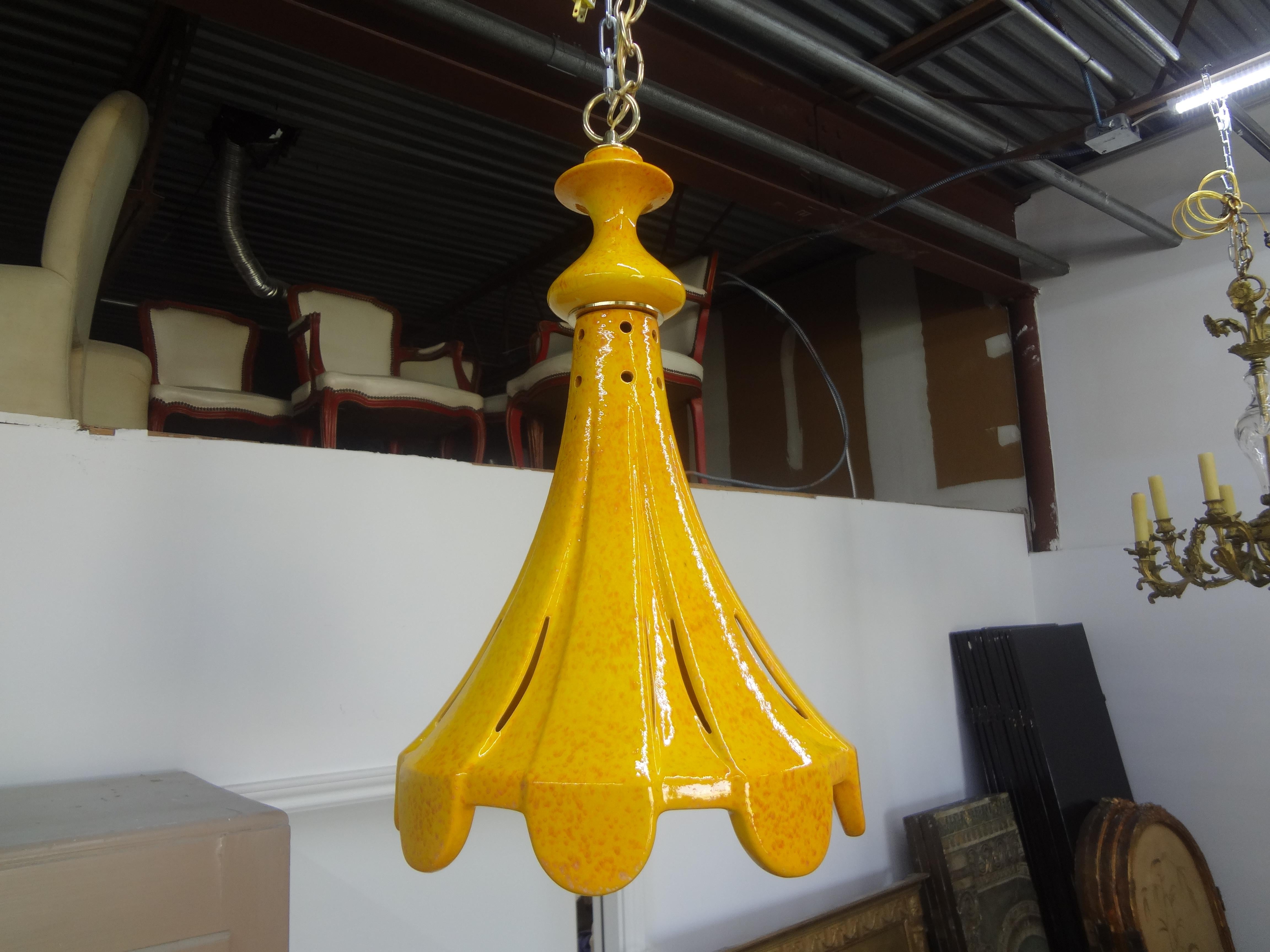 Pair of Italian glazed ceramic pendants or lanterns. This stunning pair of Italian ceramic pendants have perforated detail that emits beautiful light. These lanterns have been professionally wired with new American sockets and 36