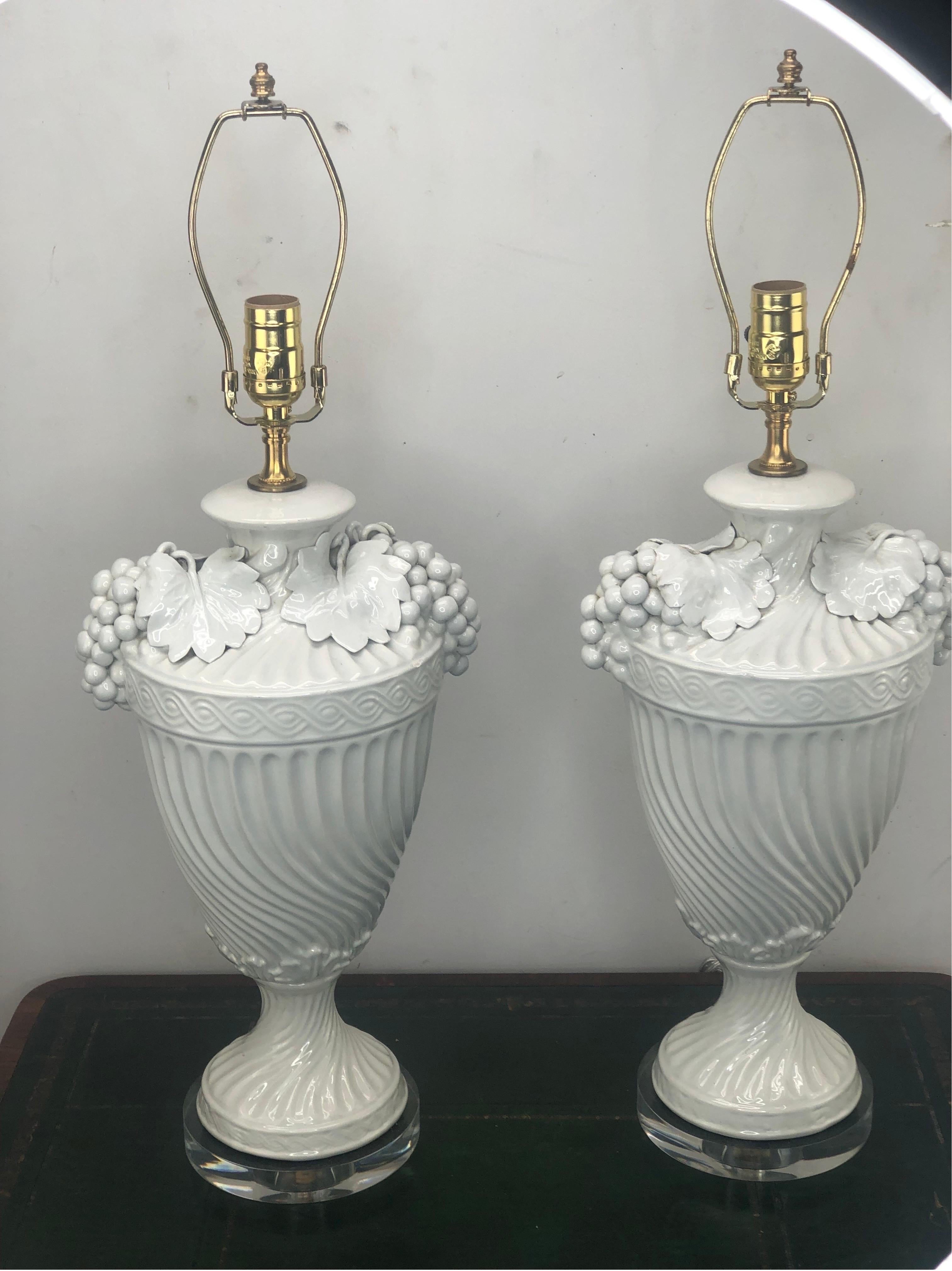 Pair of Vintage Italian Glazed Ceramic Urn Lamps With Grapes Clusters, mounted on lucite bases. Newly wired with 3-way socket.
