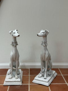 Pair of Italian glazed terracotta Greyhounds statues