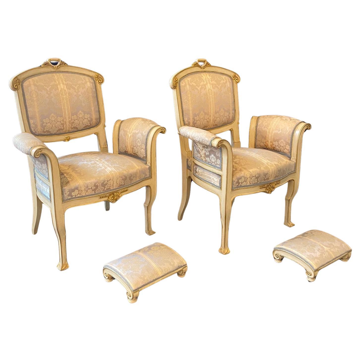 Pair of lovely and elegant Art Nouveau Italian armchairs or fauteuils with exquisite footstools, all with beautiful original muted striped damask fabric. Part of a 10-piece early 20th century Art Nouveau complete original salon suite set hand carved