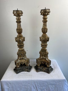 Coppia di candelieri italiani in legno dorato e argentato