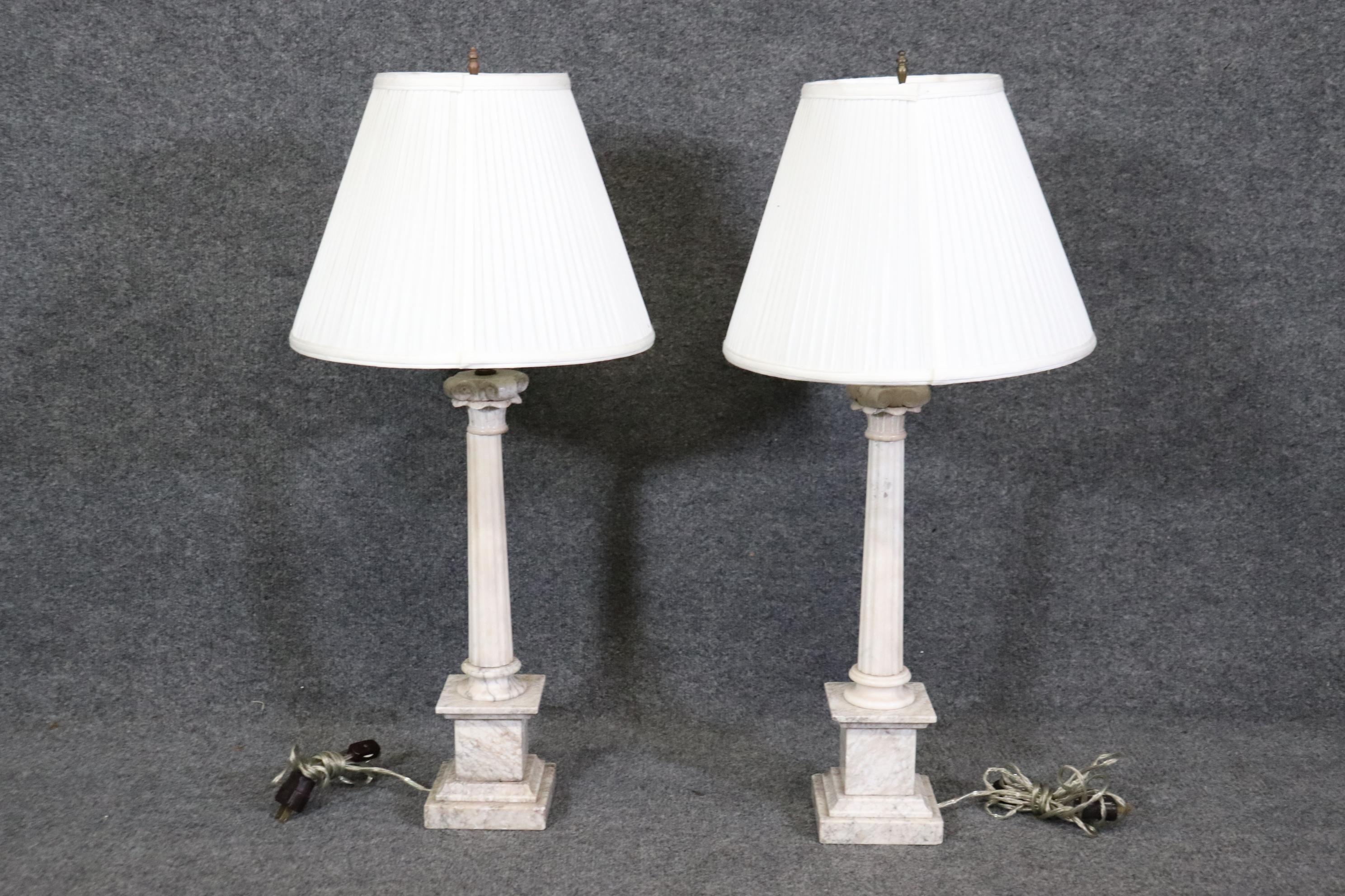 Dimensions- H: 31 1/4in W: 14 1/4in D: 14 1/4in 
This Vintage Pair of Italian Grand Tour Column Alabaster Table Lamps are out of this world and have a unique look that is not seen everyday! This pair is made of white alabaster with gray veins which