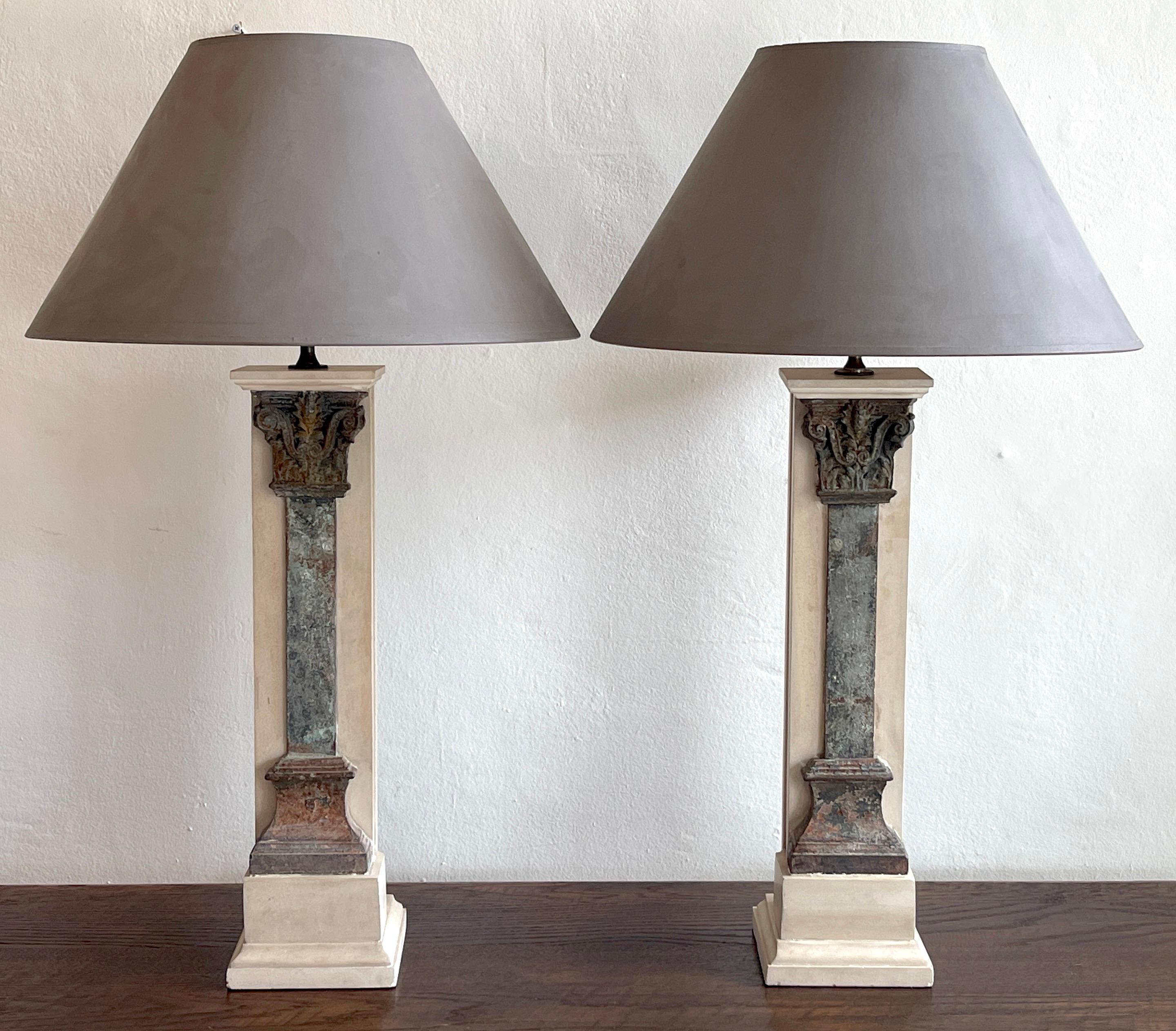 Pair of Italian grand tour style marble & column lamps
Each one a substantial marble column mounted with a inset verdigris Corinthian Column.

Each lamp measures 35