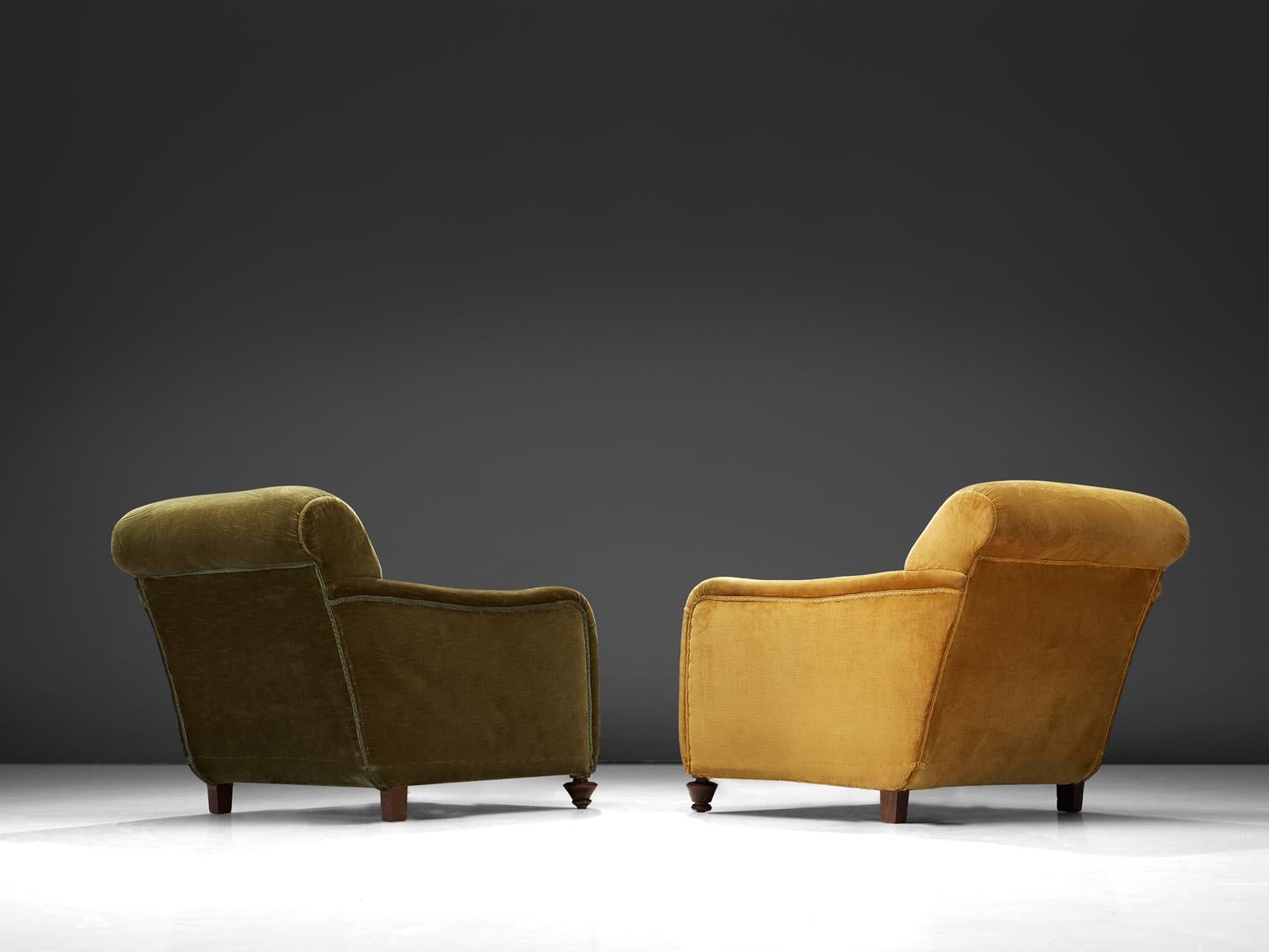Set of two lounge chairs, green and yellow velvet fabric, wood, Italy, 1940s. 

Wide and comfortable chairs in green and yellow velvet fabric upholstery. Truly extraordinary lounge chairs that feature a very deep seat and cornered curved armrests.