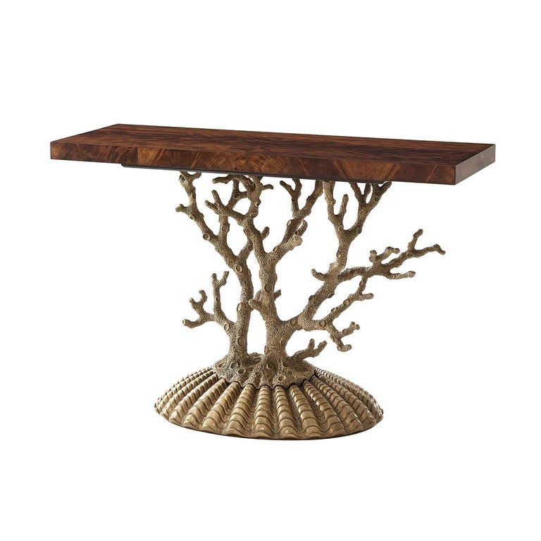A pair of unusual Grotto console tables, with a rectangular flame veneered mahogany top on a branching coral cast metal support and shell form cast metal base.

Dimensions: 48