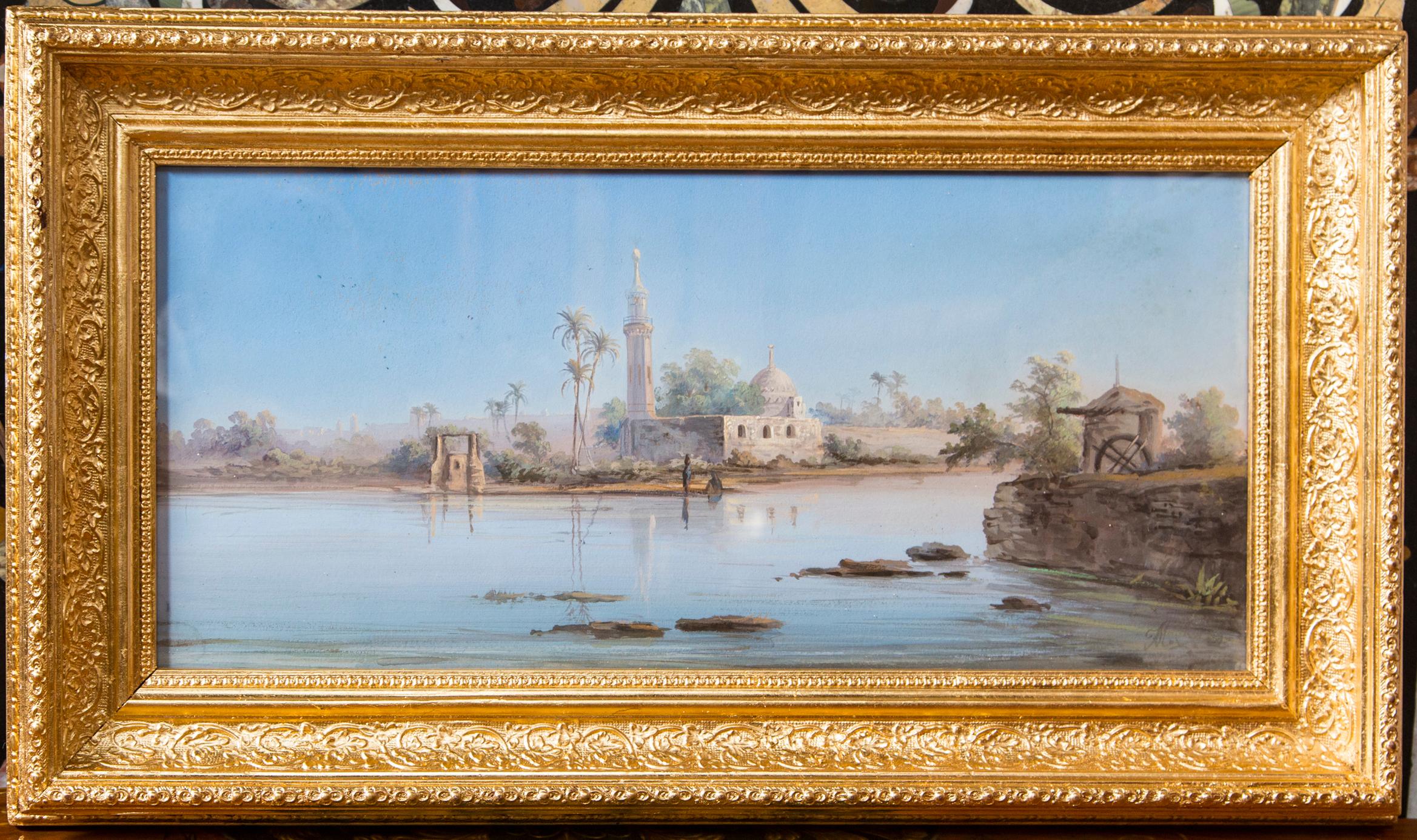 Set within newly gilded wood frames. Each is illegibly signed.
One of figures seated and standing along a lake or riverbank. Dwellings and palm trees in the background.
The other  of  a   minaret  and other  structures.  