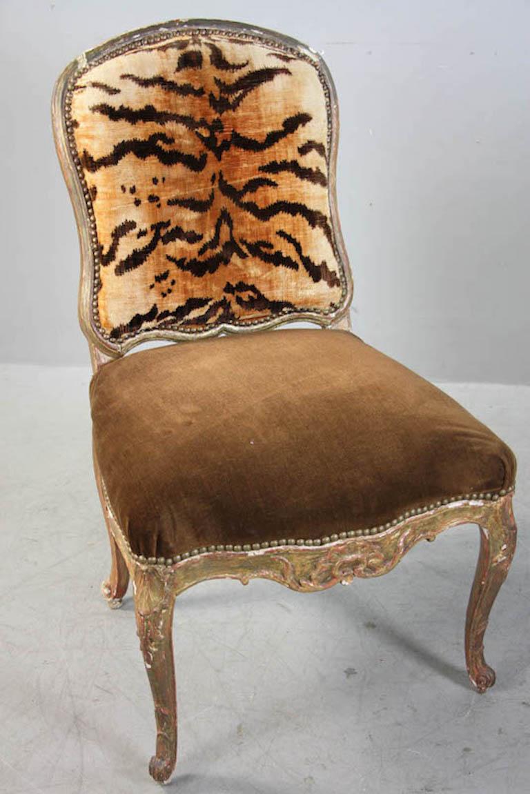 Pair of Italian 18th century hand-carved florentine gilt chairs Louis V style with cartouche back with original zebra/ animal print upholstery, paint loss, faded, gilt loss
Measures: 36