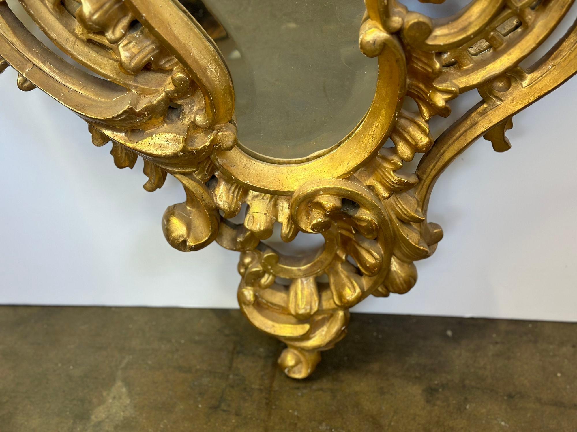 Early 20th Century Pair of Italian Hand Carved Giltwood Mirrors, c. 1900's For Sale