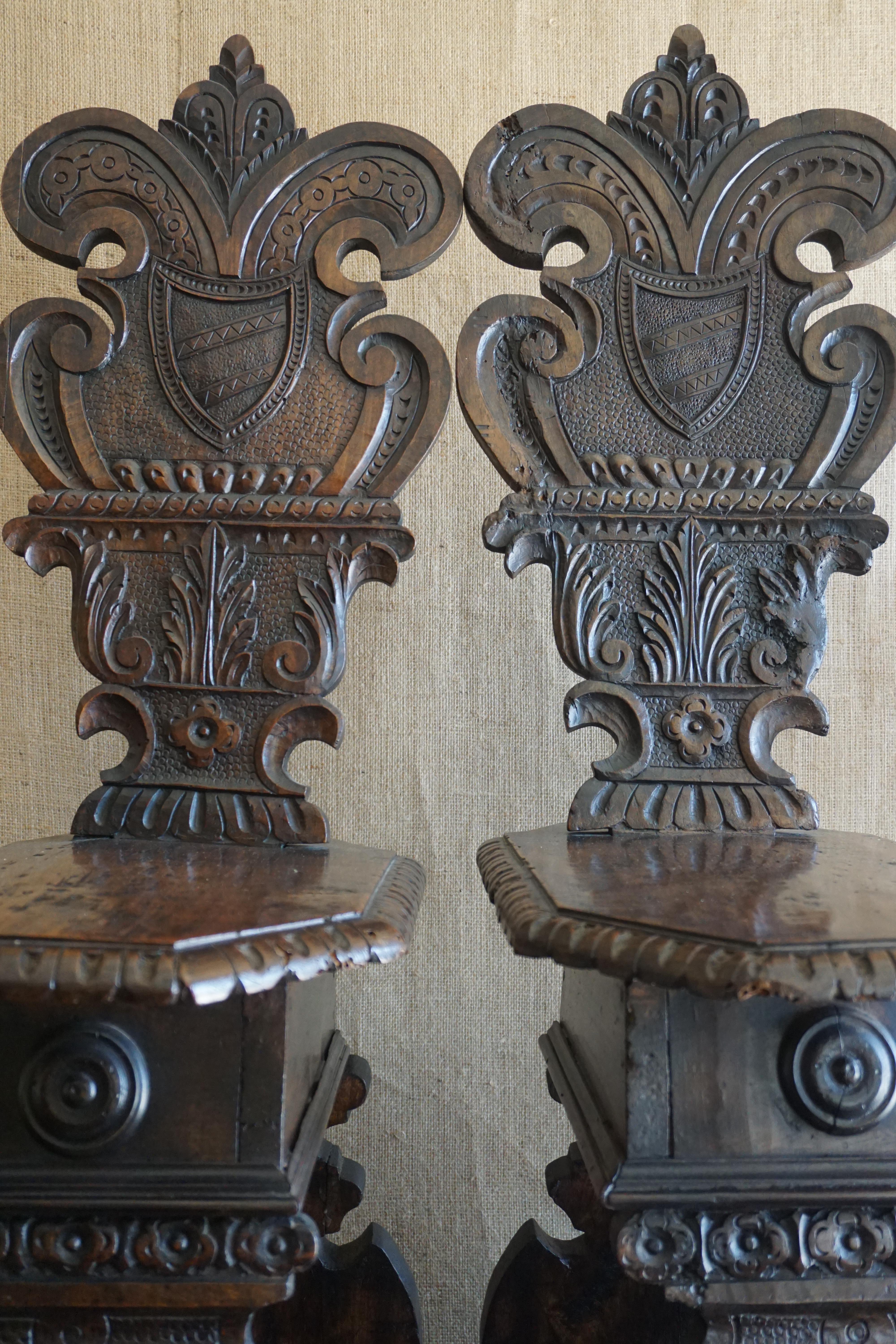 Here we have a lovely pair of hand carved walnut chairs fashioned in the Renaissance Revival style. 

Origin: Italy

circa 1810

Measurements:

19