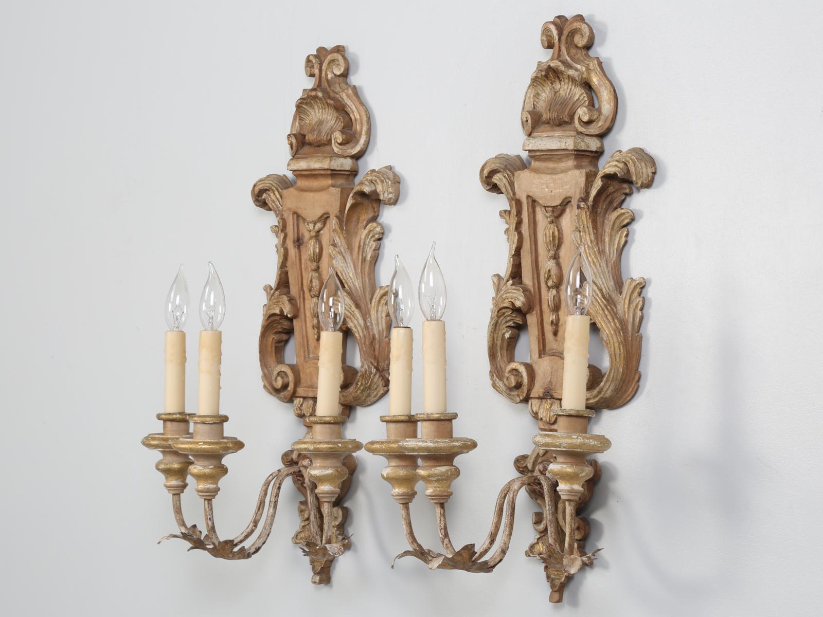 Beautiful pair of vintage Italian sconces, that were recently removed from a local house, so you know they were working. The matched pair of Italian wooden sconces were hand carved and probably date from the 1930s-1940s.