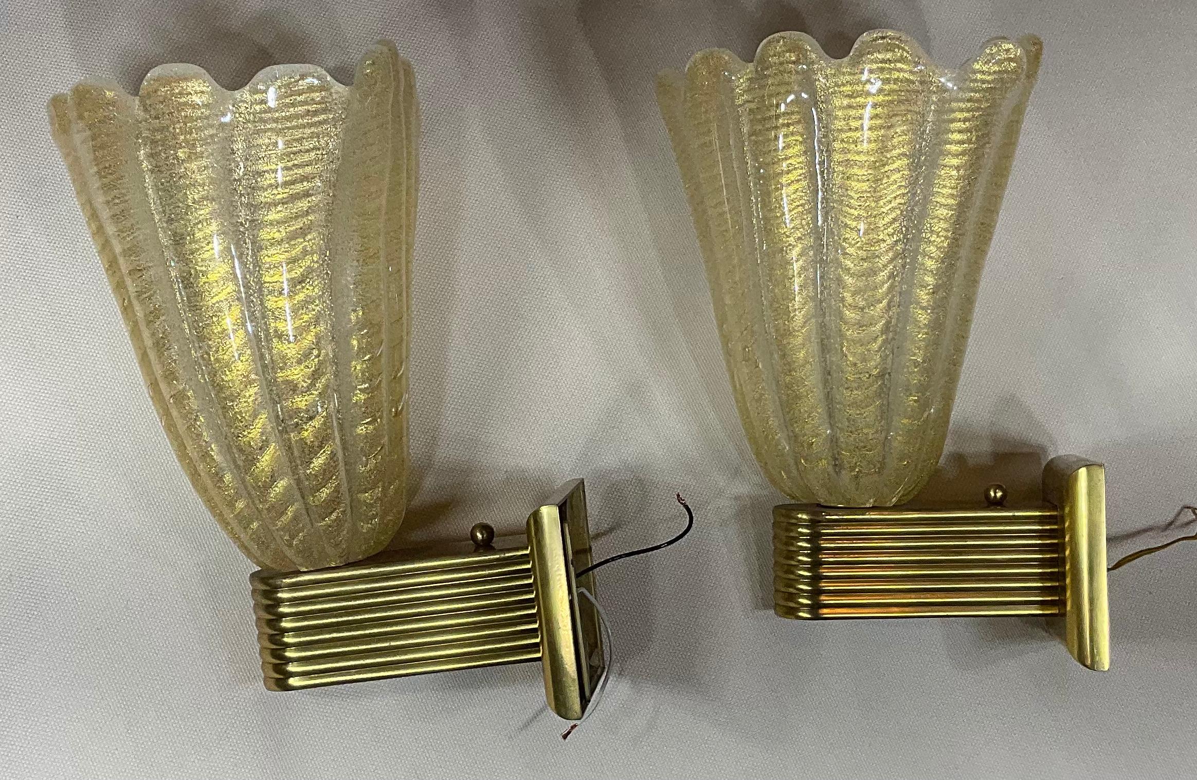 Elegant pair of hand blown glass sconces made probably by Barovier and Toso. From Italy . The murano glass sconces are mounted on nice brass backplate
Glass size is slightly different.
Exceptional object of art for wall display.
Sizes:
1. 9”